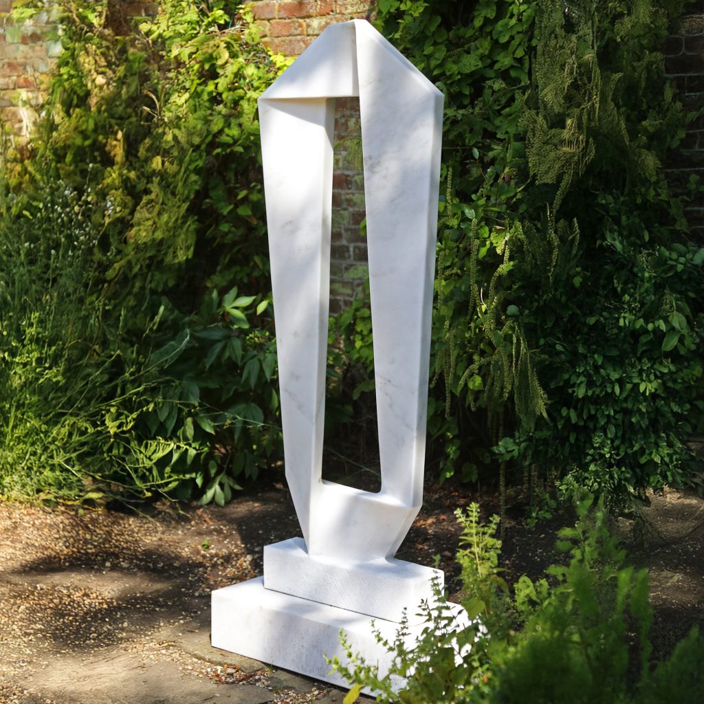 A abstract marble sculpture of a band wrapped around into a rectangle shape.