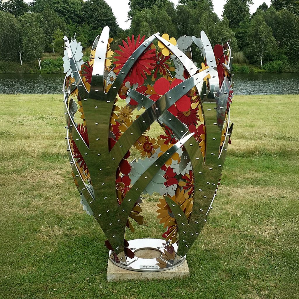 A floral stainless steel and aluminium sculpture of a closed bud full of flowers.
