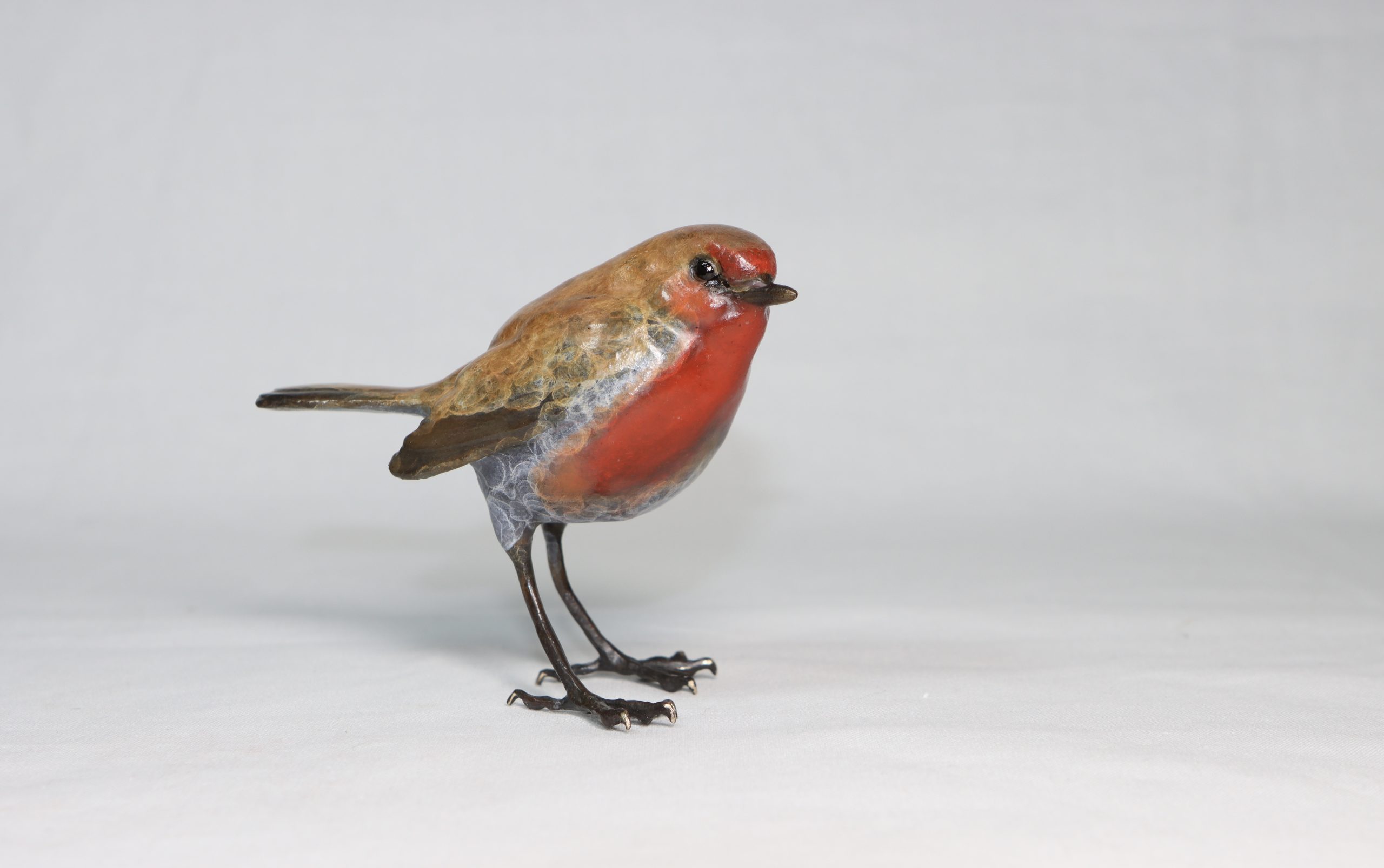 Robin by Steve Langford is a beautiful life size sculpture of a Robin made of solid bronze.