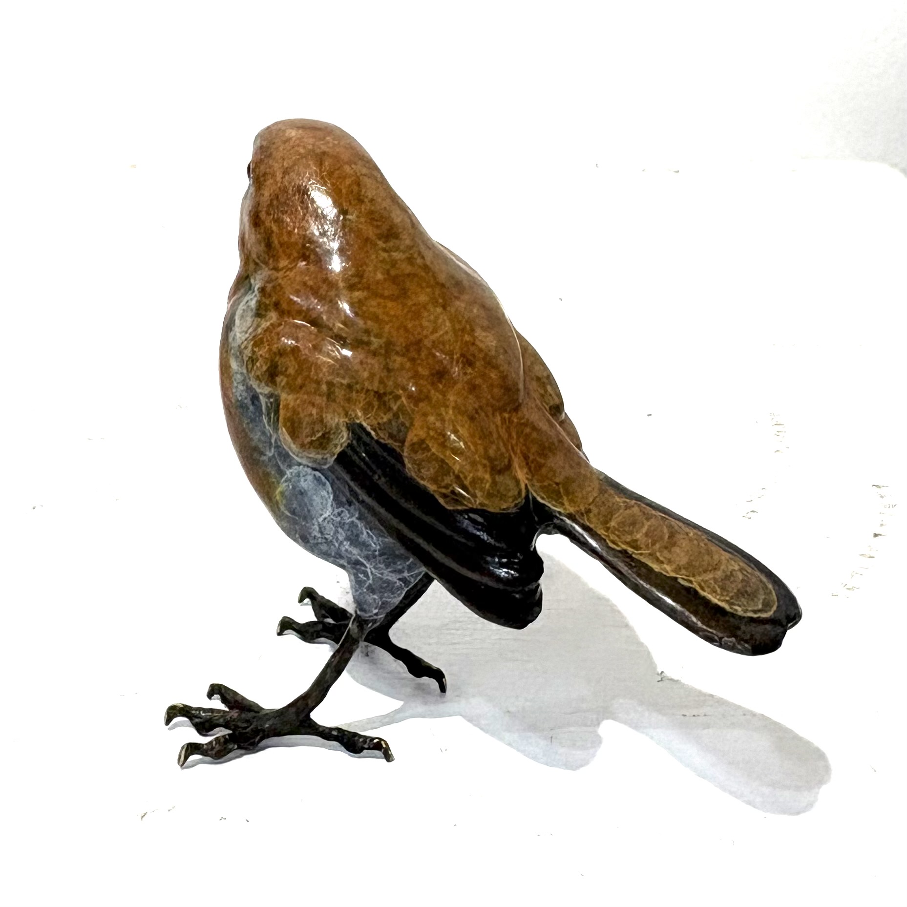 Robin by Steve Langford is a beautiful life size sculpture of a Robin made of solid bronze.