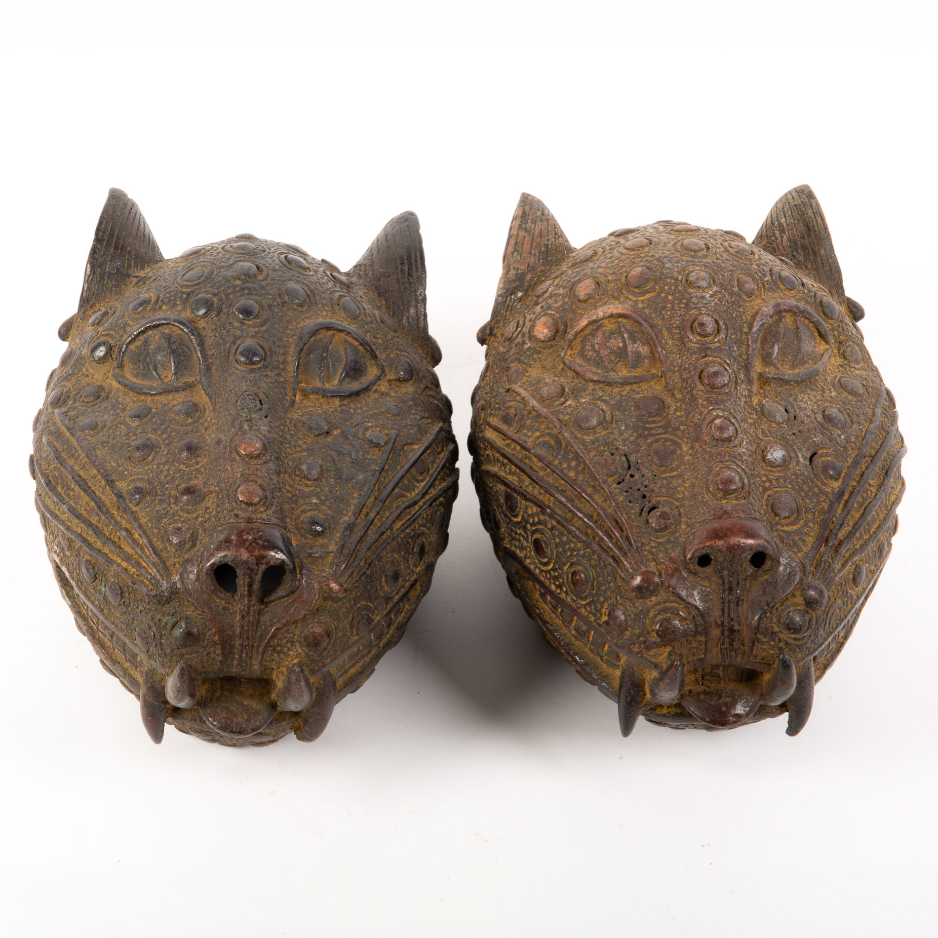 A pair of bronze sculpture masks for two cheetah heads.