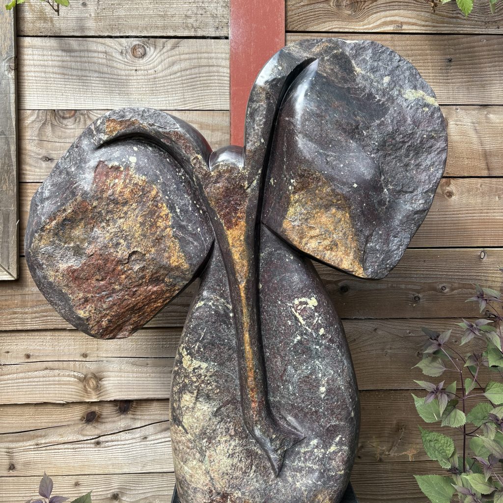 Happy Elephant by Fungai Dodzo. Unique Shona sculpture of an elephant made from cobalt stone.