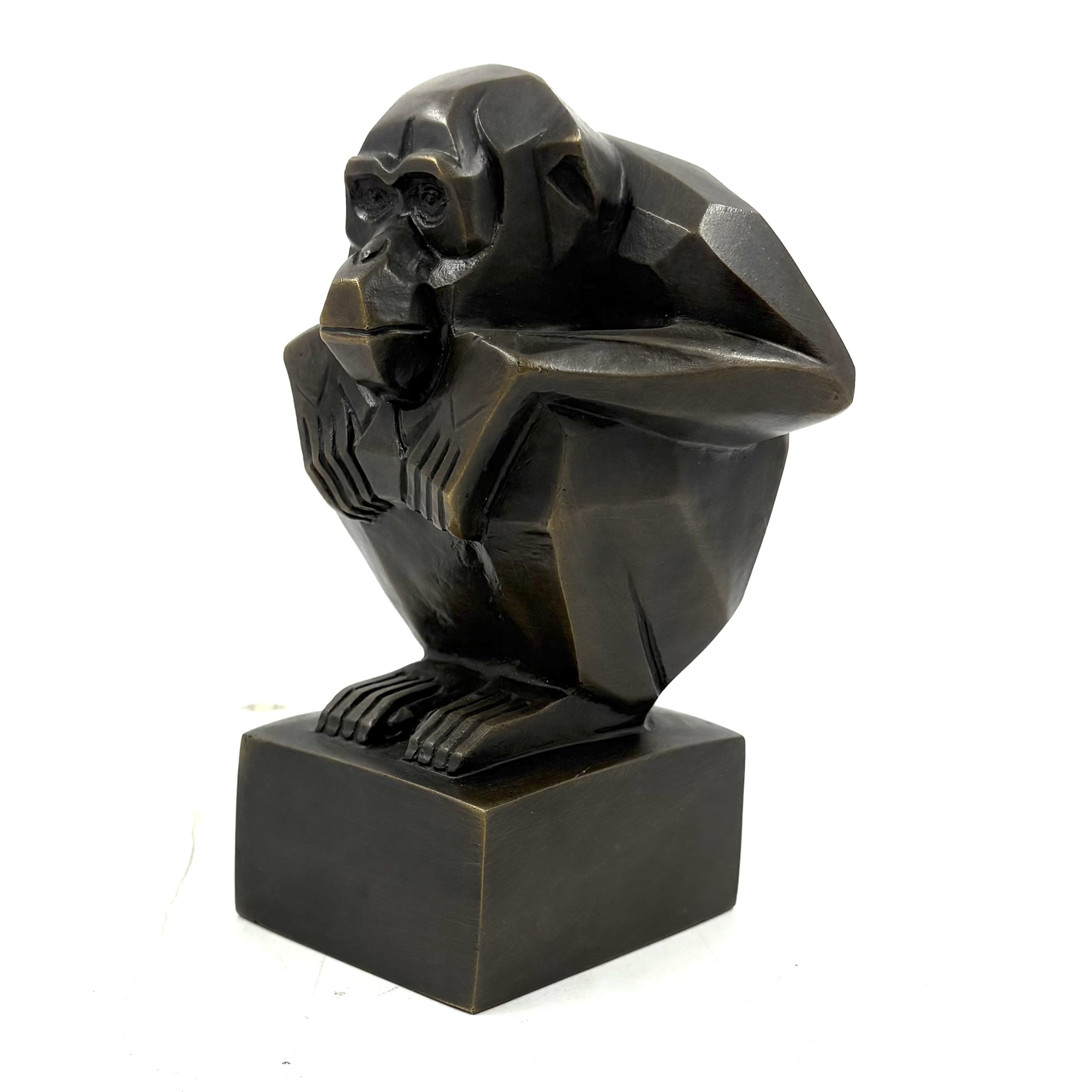 Art Deco Monkey is a small bronze monkey in a crouching position with his hands resting on his knees