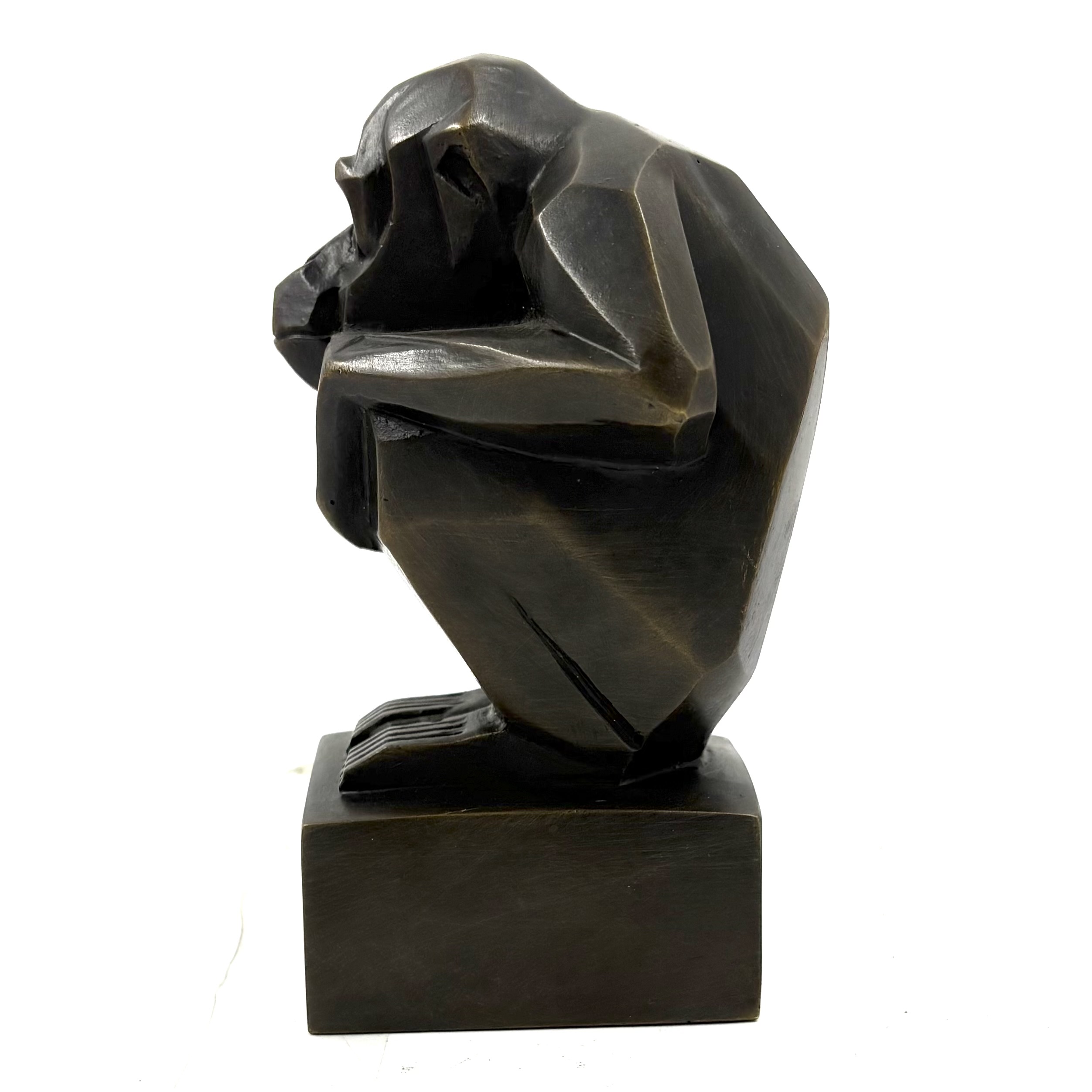 Art Deco Monkey is a small bronze monkey in a crouching position with his hands resting on his knees