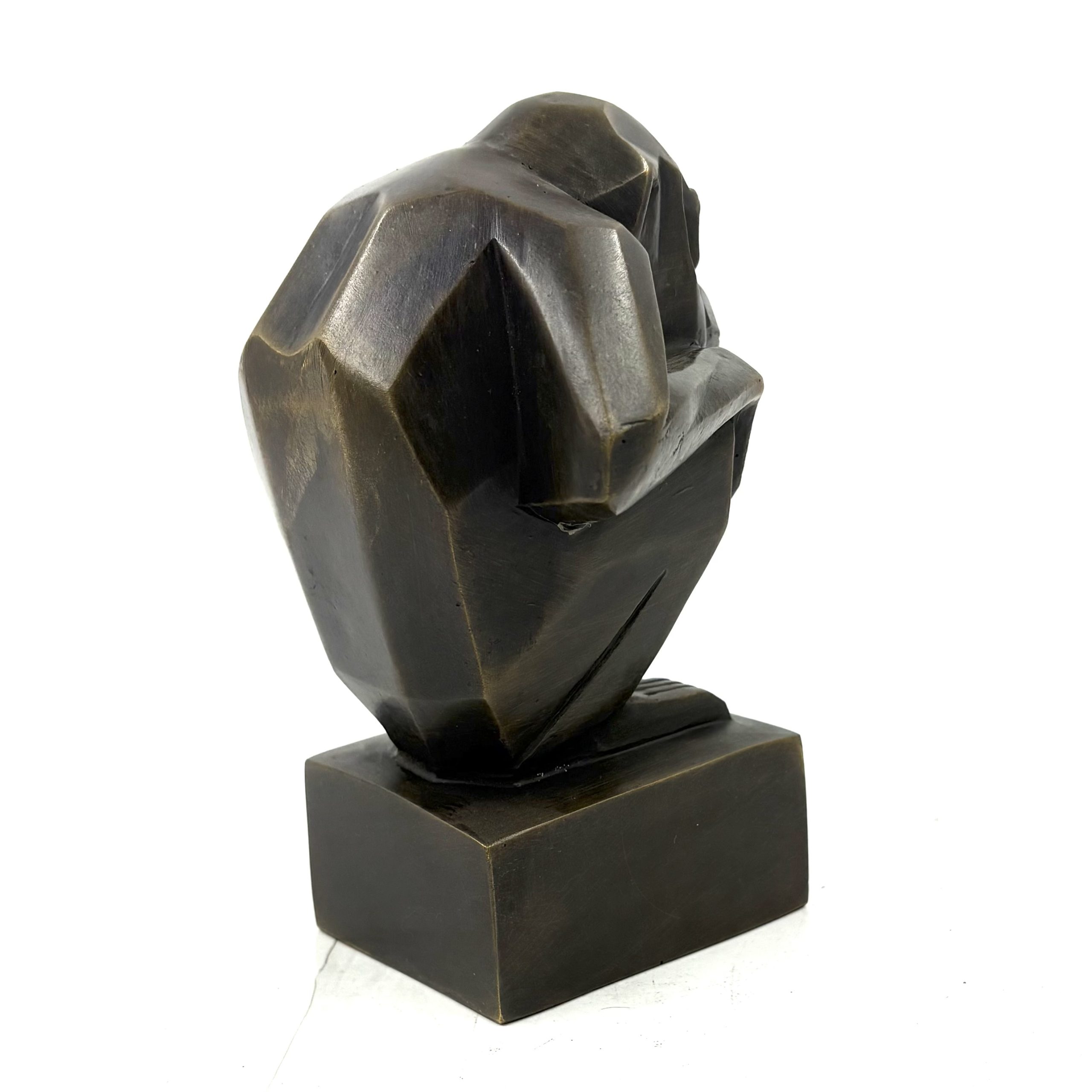 Art Deco Monkey is a small bronze monkey in a crouching position with his hands resting on his knees
