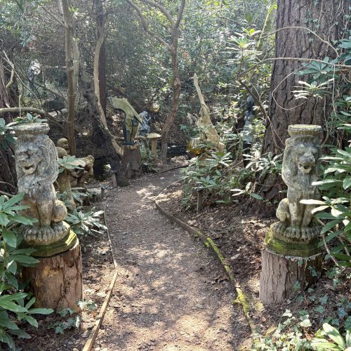 A Pair Sejant Lions are two 20th Century antique finial sculptures made from Composite Stone and well suited to a gate, either side of a path or driveway