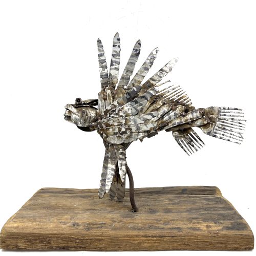 Lionfish by Clive Fredriksson. Unique table-top sized metal and wood aquatic sculpture made using cutlery and other found objects.