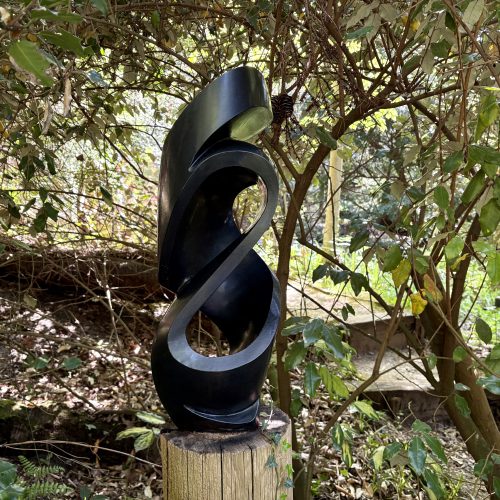 Dancer by Munyardi Jeche is a table top indoor or outdoor abstract flowing Shona sculpture carved from one piece of Springstone