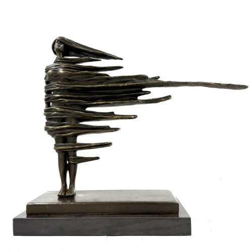 Surrealist Dancer by In the Style of Salvador Dali. Bronze scupture of a female figure with long flowing hair, set on a marble base.