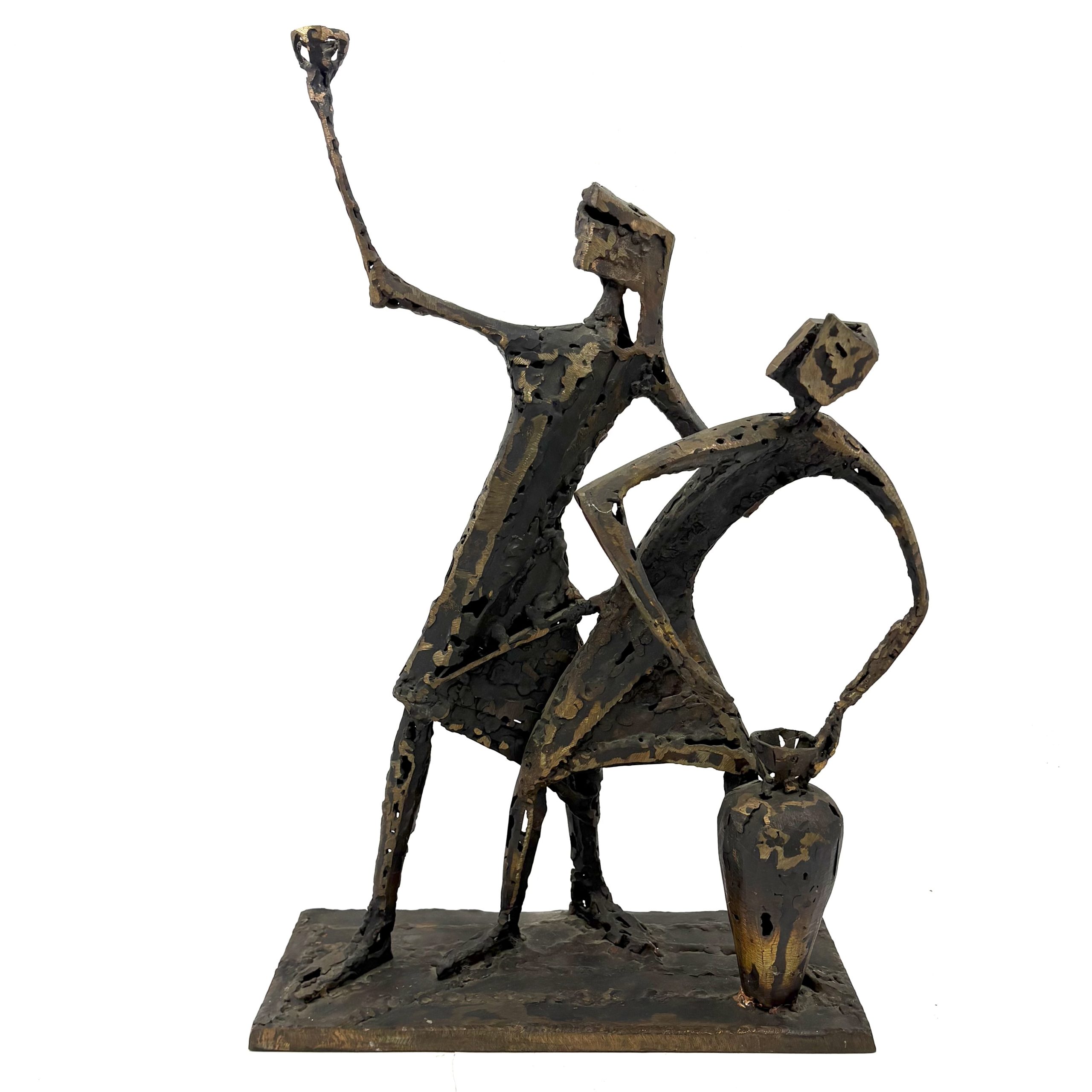 Two Figures by Sean Crampton. A unique sculpture made from welded bronze depicting two figures standing side by side along with a large vessel or vase.