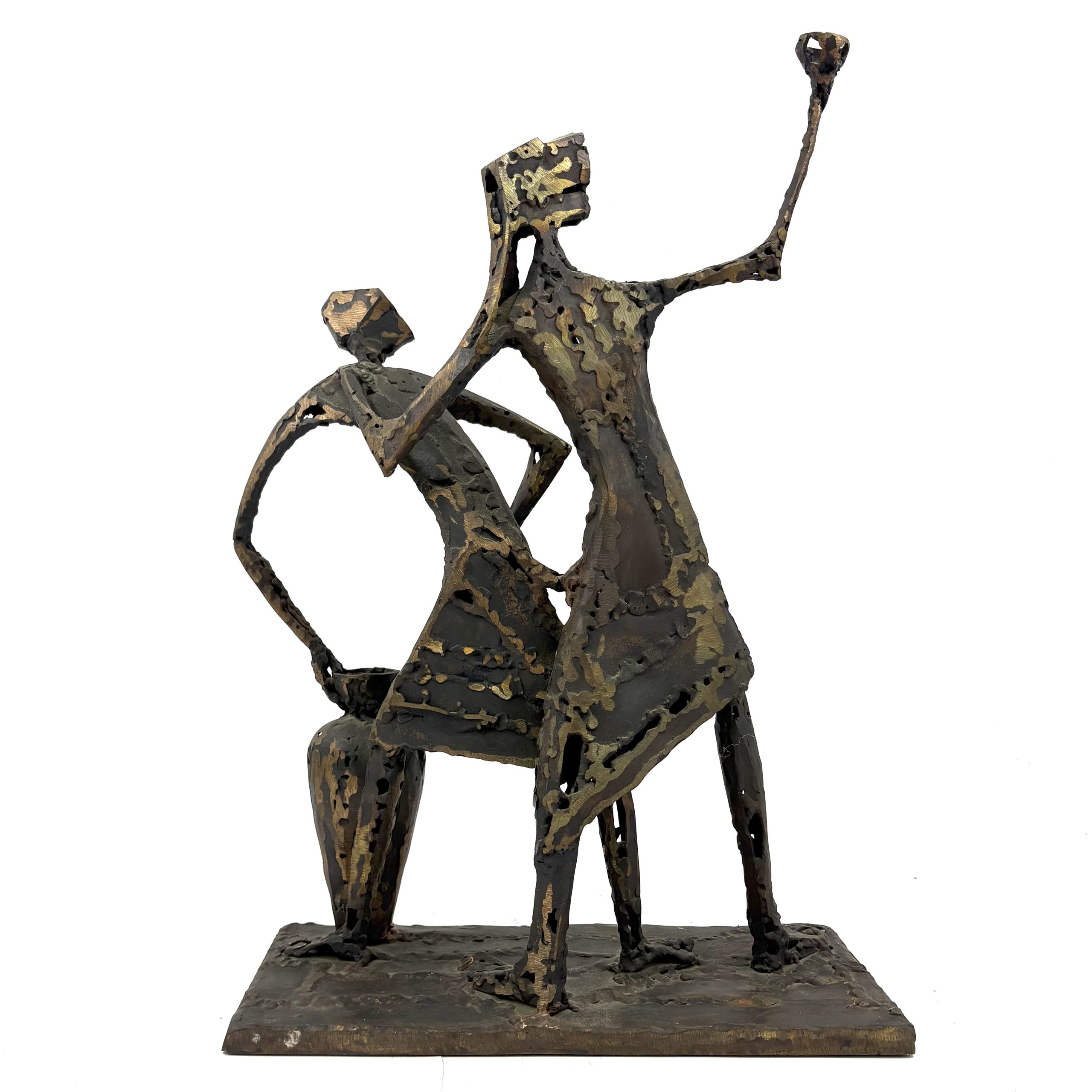 Two Figures by Sean Crampton. A unique sculpture made from welded bronze depicting two figures standing side by side along with a large vessel or vase.