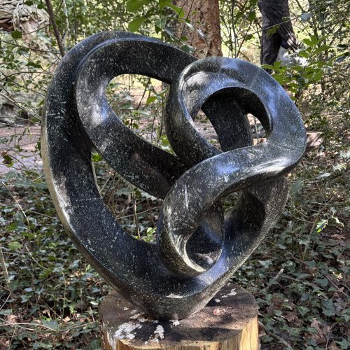 Harmony of the Heart by Tafadzwa Chanakira is a large abstract leopard rock stone Shona Zimbabwean sculpture suitable for indoor or outdoor display