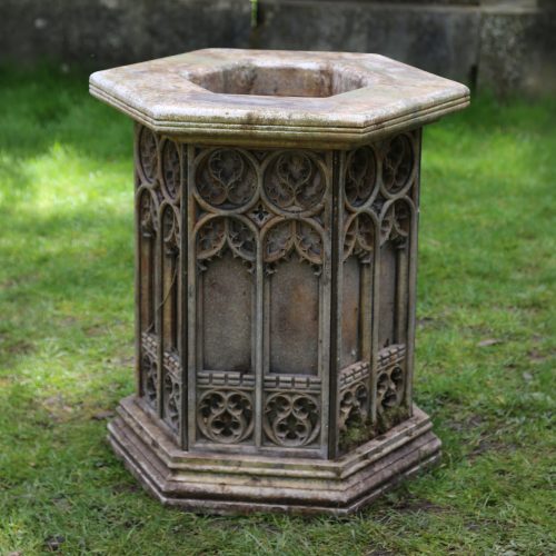 Gothic Font. A gothic style decorative church baptismal font made from stone and brass and inscribed 'Laus Deo' (Praise be to god).