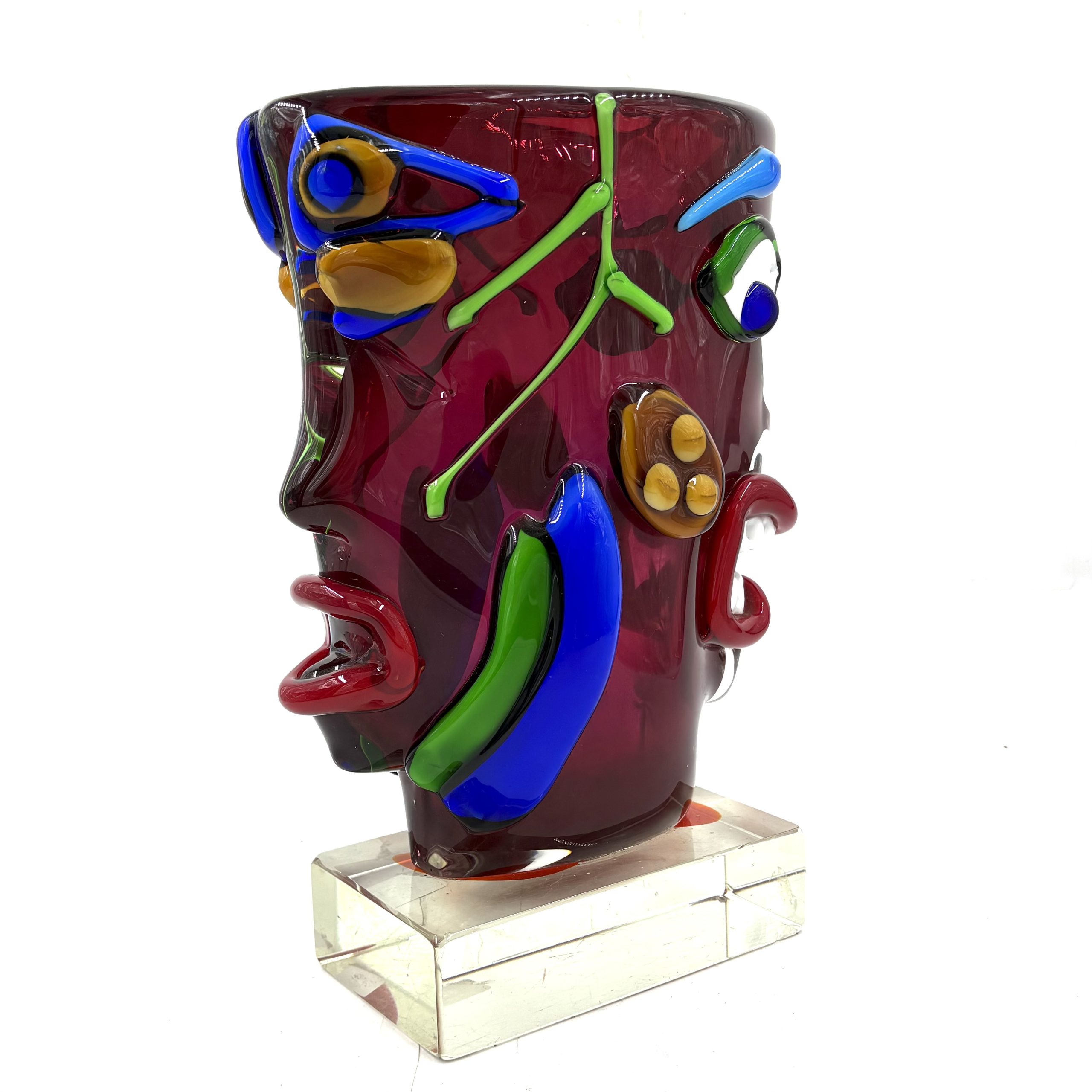 Homage to Picasso by Sandro Frattin. Unique Murano glass vase in red, blue, green and yellow. The outside of the vase is formed into the shape of two simplistic human faces.