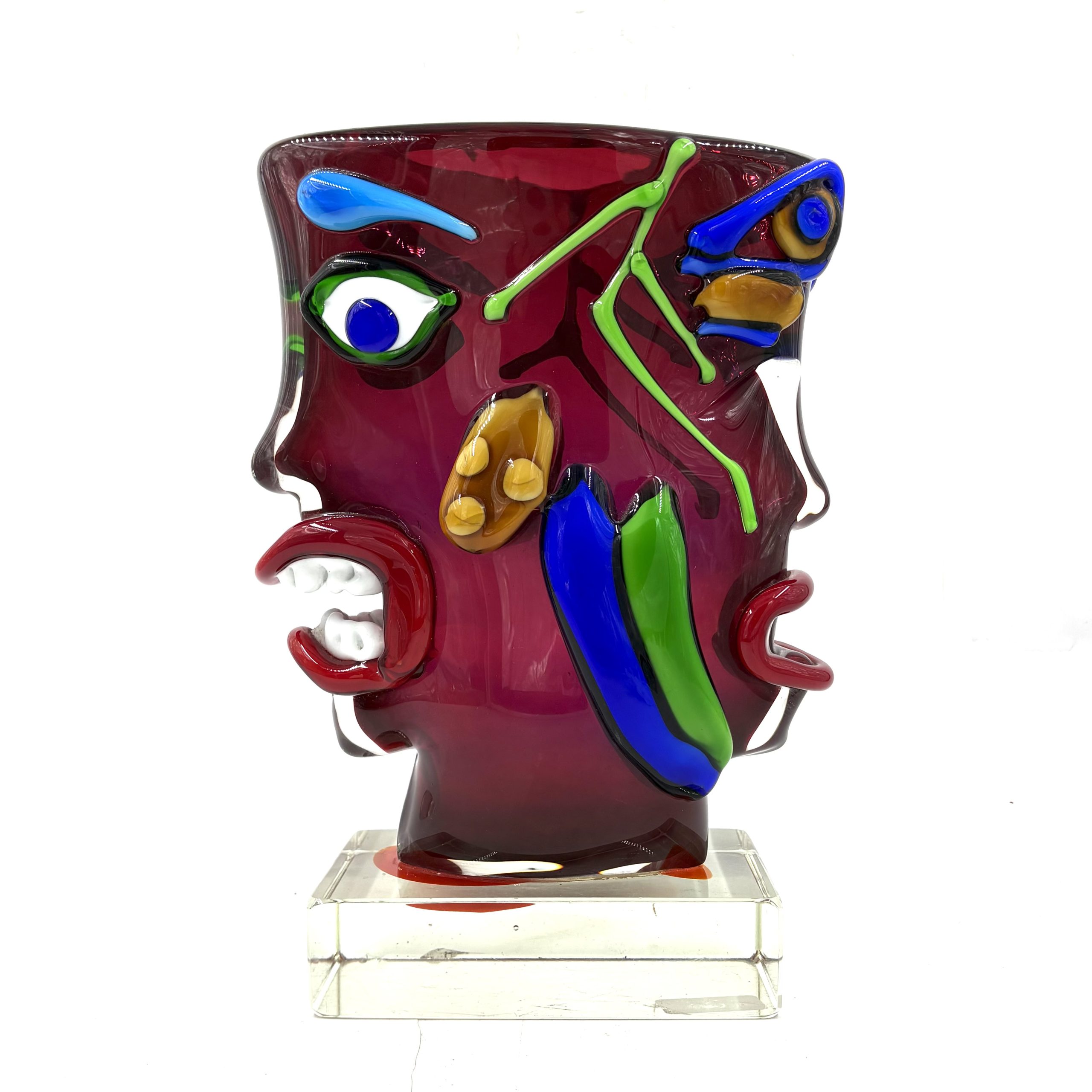 Homage to Picasso by Sandro Frattin. Unique Murano glass vase in red, blue, green and yellow. The outside of the vase is formed into the shape of two simplistic human faces.