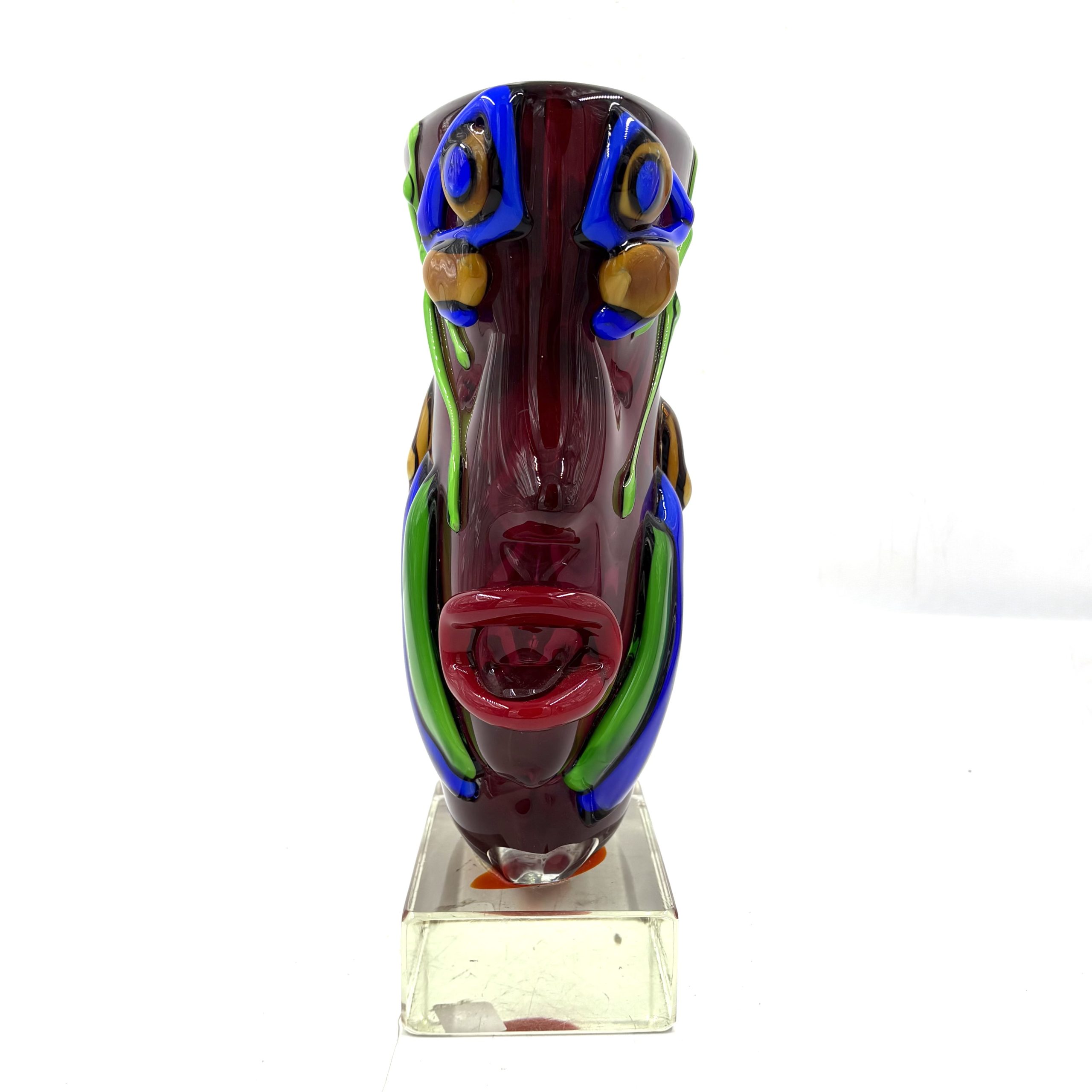 Homage to Picasso by Sandro Frattin. Unique Murano glass vase in red, blue, green and yellow. The outside of the vase is formed into the shape of two simplistic human faces.