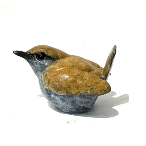 Wren by Steve Boss is a delightful solid bronze lifesize sculpture of a tiny Jenny Wren. It sits flas on it's belly