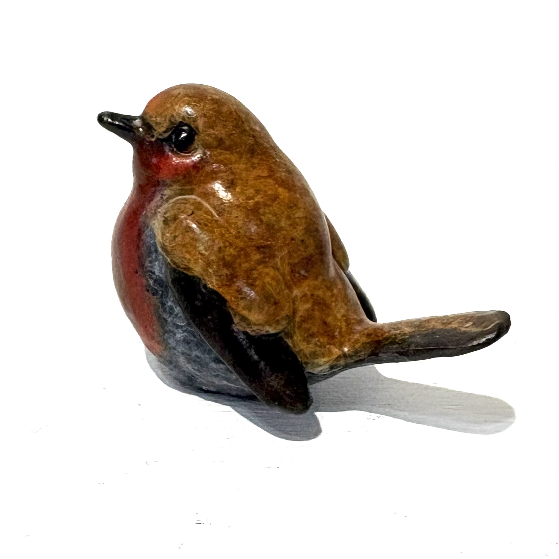 Robin (tiny) by Steve Langford. Small bronze bird sculpture of a robin that captures the warmth and charm of this iconic songbird