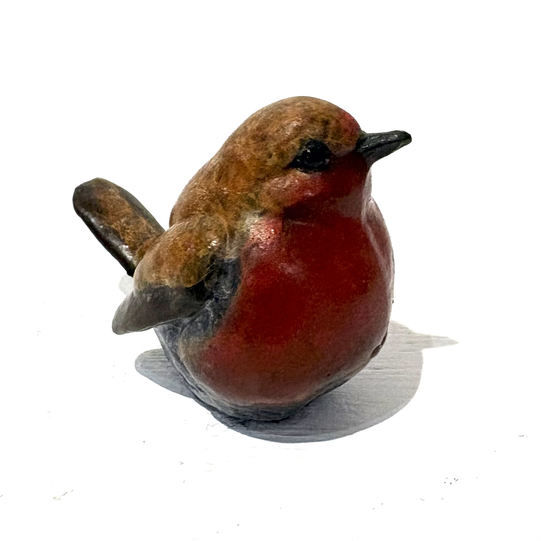 Robin (tiny) by Steve Langford. Small bronze bird sculpture of a robin that captures the warmth and charm of this iconic songbird