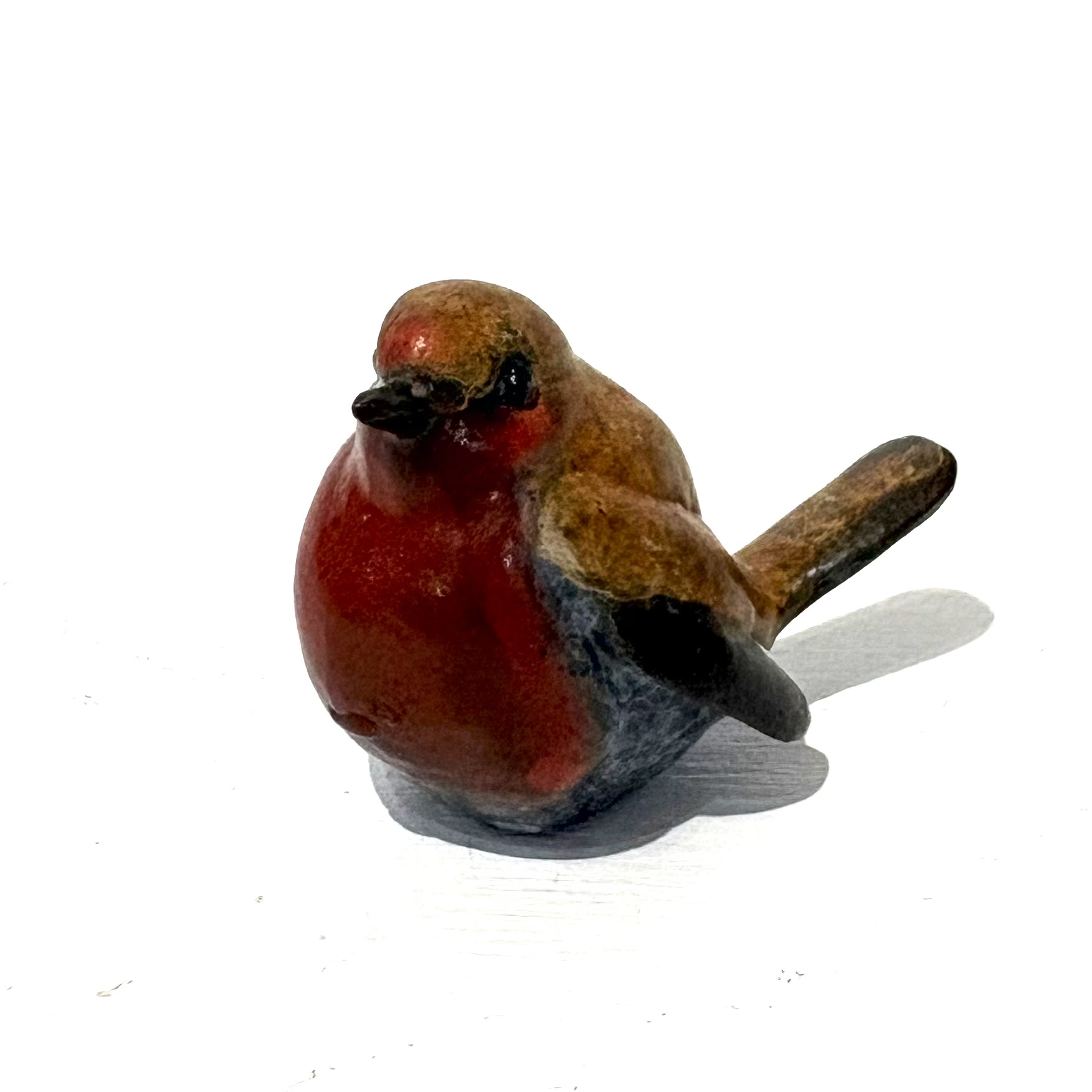 Robin (tiny) by Steve Langford. Small bronze bird sculpture of a robin that captures the warmth and charm of this iconic songbird
