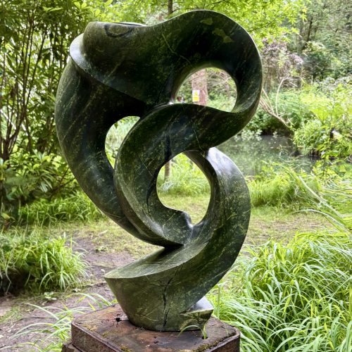 Meditating by Sylvester Samanyanga. Unique abstract avocado stone sculpture.