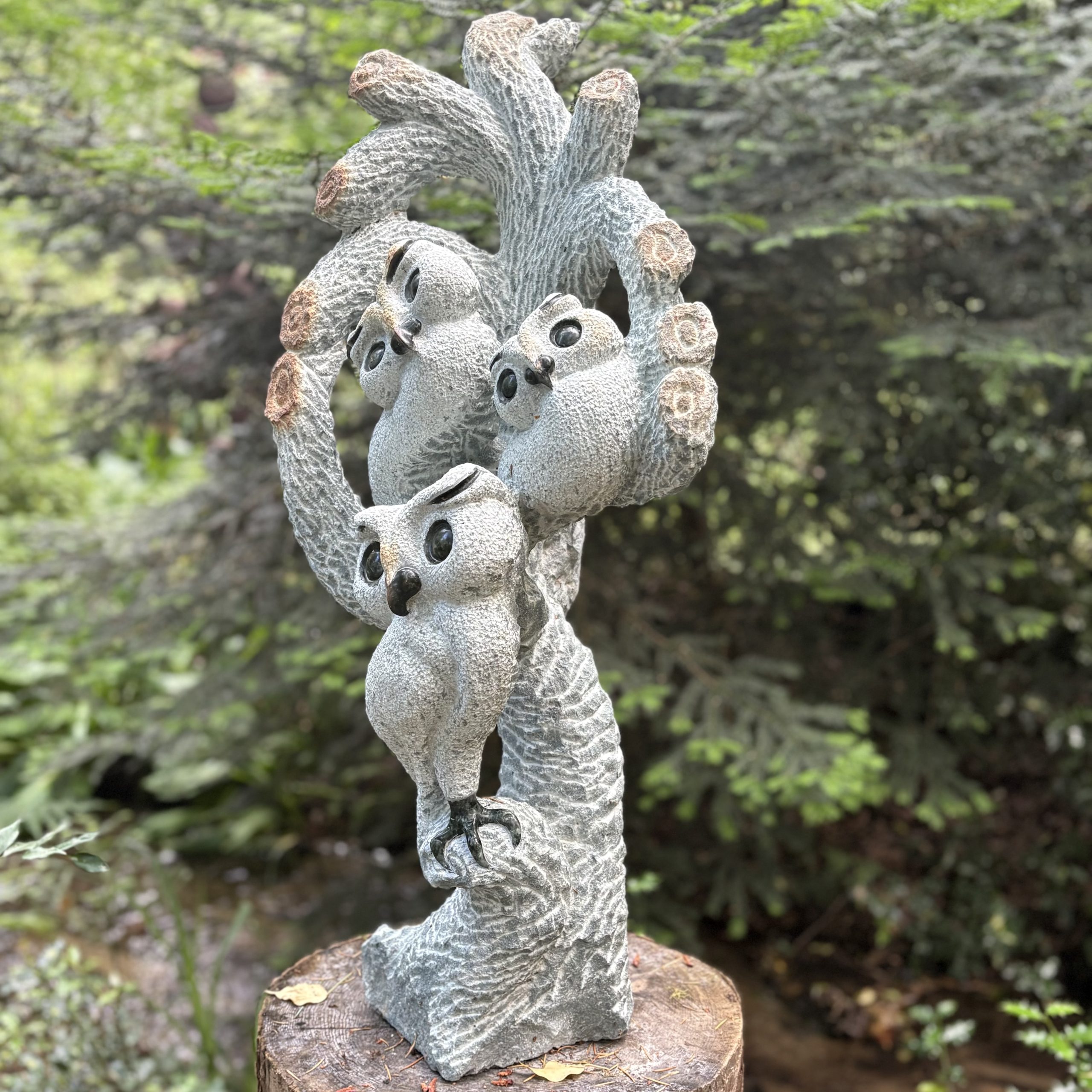 Together We Grow by Taurai Mupaso. Unique, large, Shona sculpture of three owls perched together in a tree. Carved from opal stone.