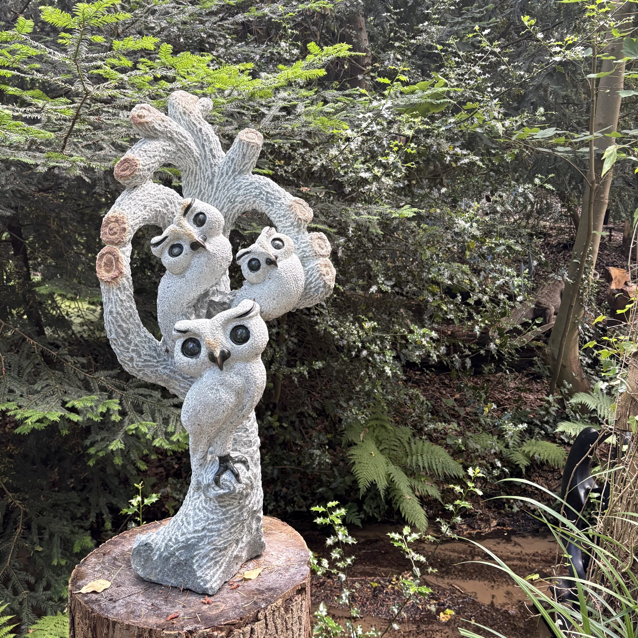 Together We Grow by Taurai Mupaso. Unique, large, Shona sculpture of three owls perched together in a tree. Carved from opal stone.