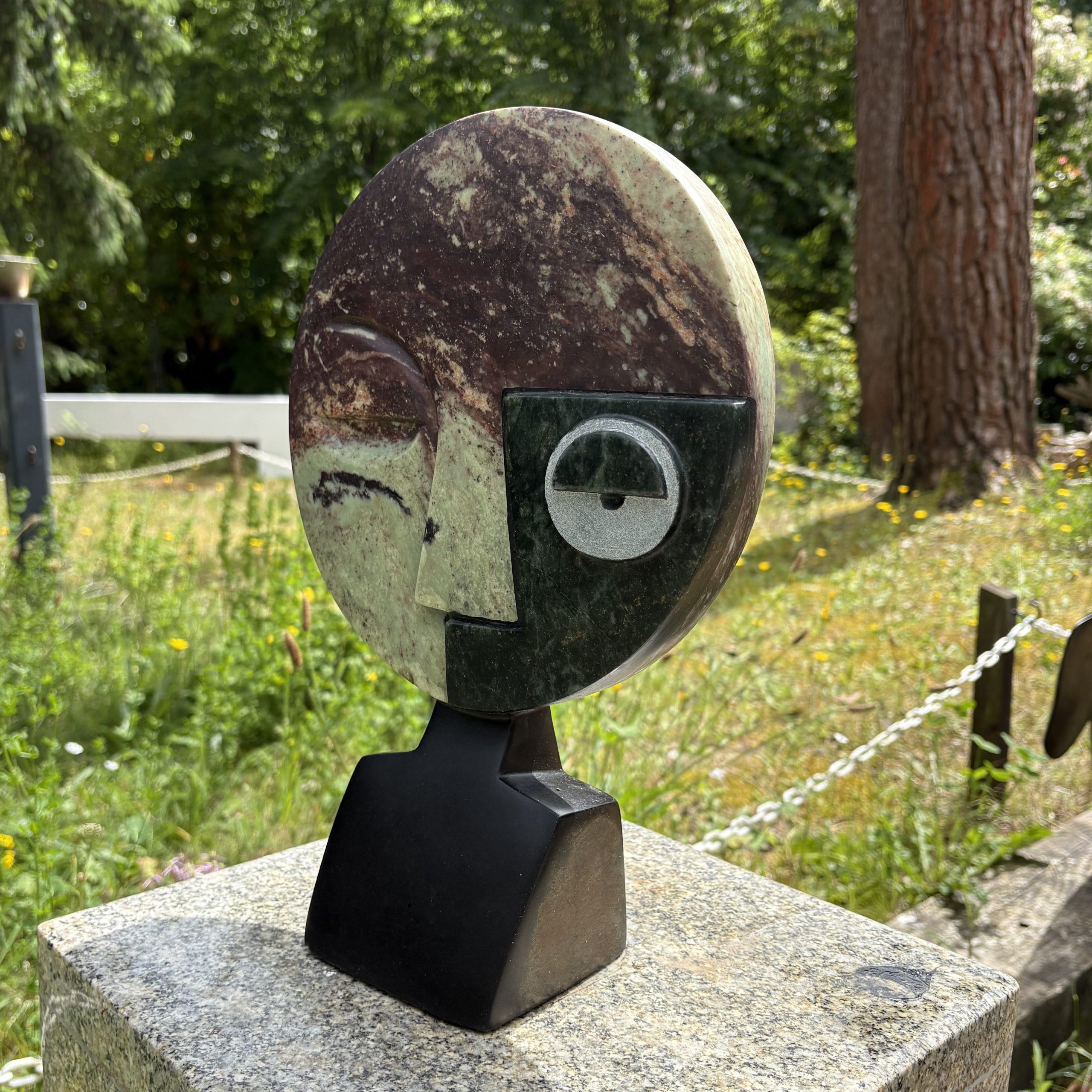 Visionary by Taylor Nkom. A unique, Cobalt, Opal and Springstone Shona sculpture of an abstract style face. The different stones add definition and colour.