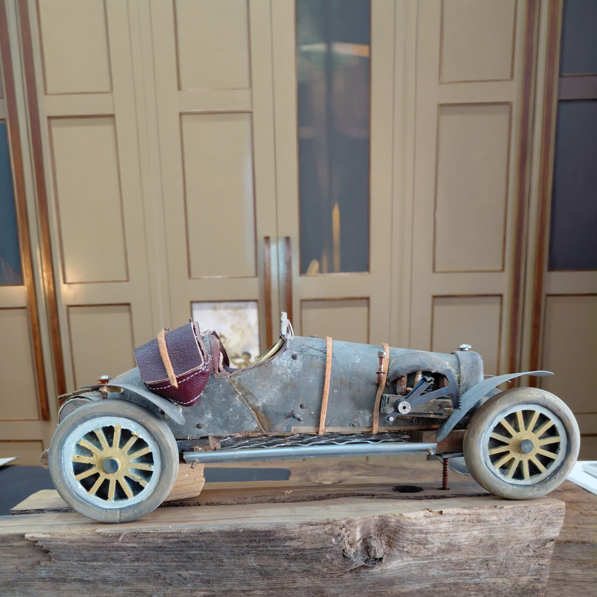 Bugatti. Unique table-top sized car sculpture made from metal, leather and wood.
