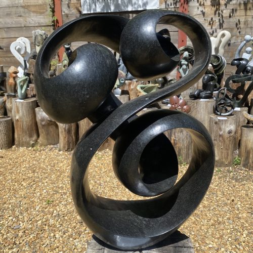The Race Is On by Tonderai Sowa. Unique Springstone, abstract sculpture with flowing lines and balanced forms, a contemporary interpretation of Shona sculpture.