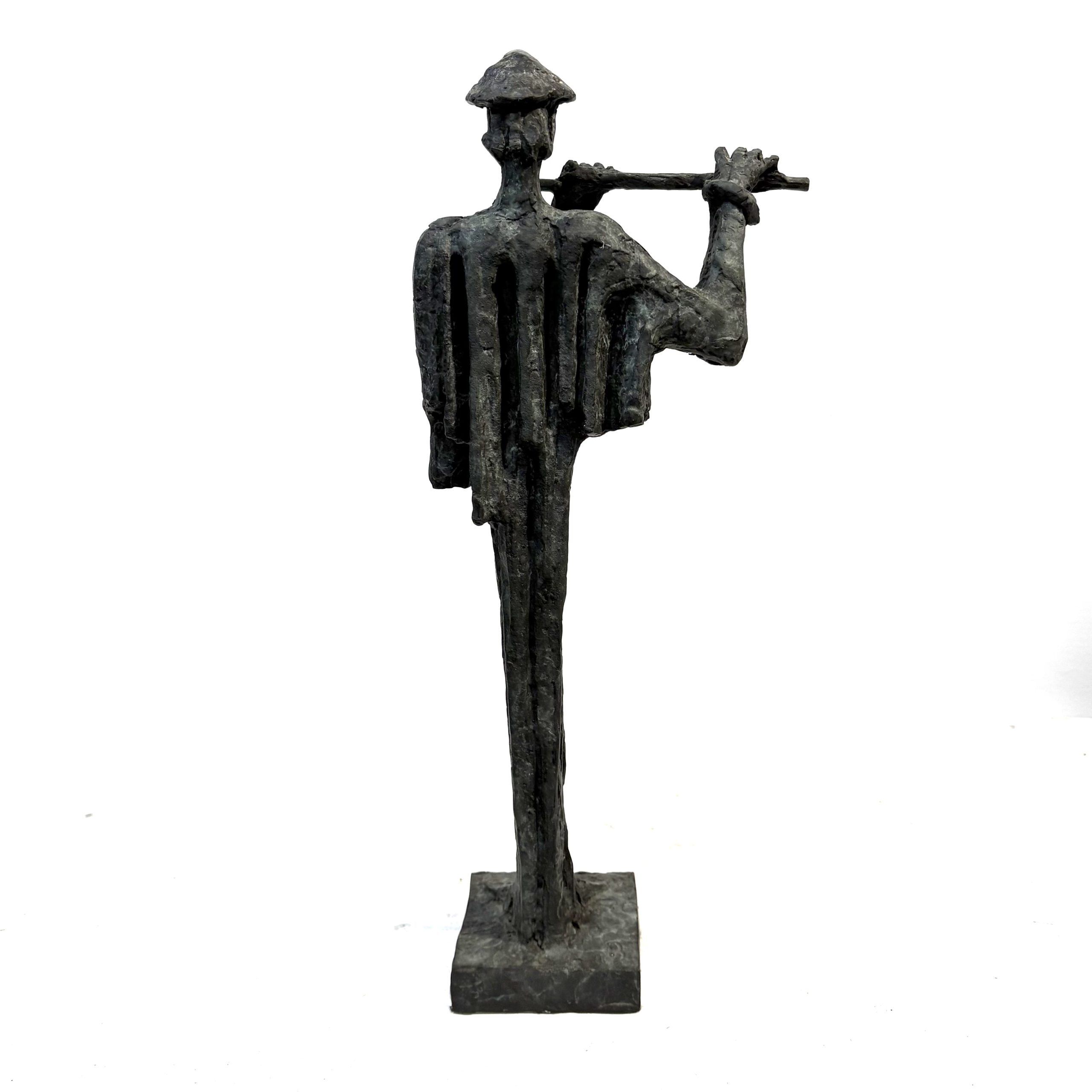 Flautist Maquette By Sean Crampton. Table-top sized bronze sculpture of a man playing the flute. He wears and pointed hat.