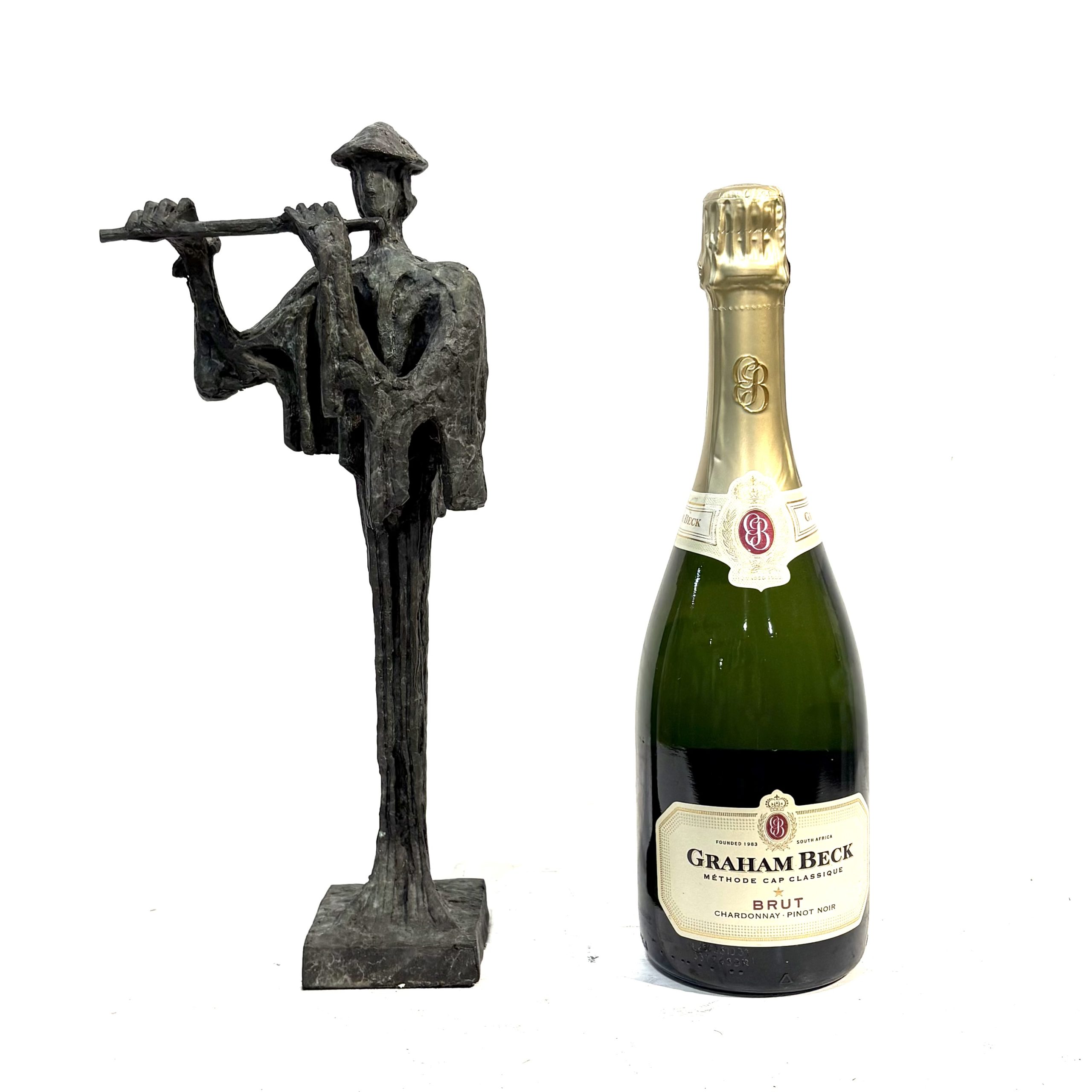 Flautist Maquette By Sean Crampton. Flautist Maquette By Sean Crampton. Table-top sized bronze sculpture of a man playing the flute. He wears a pointed hat.