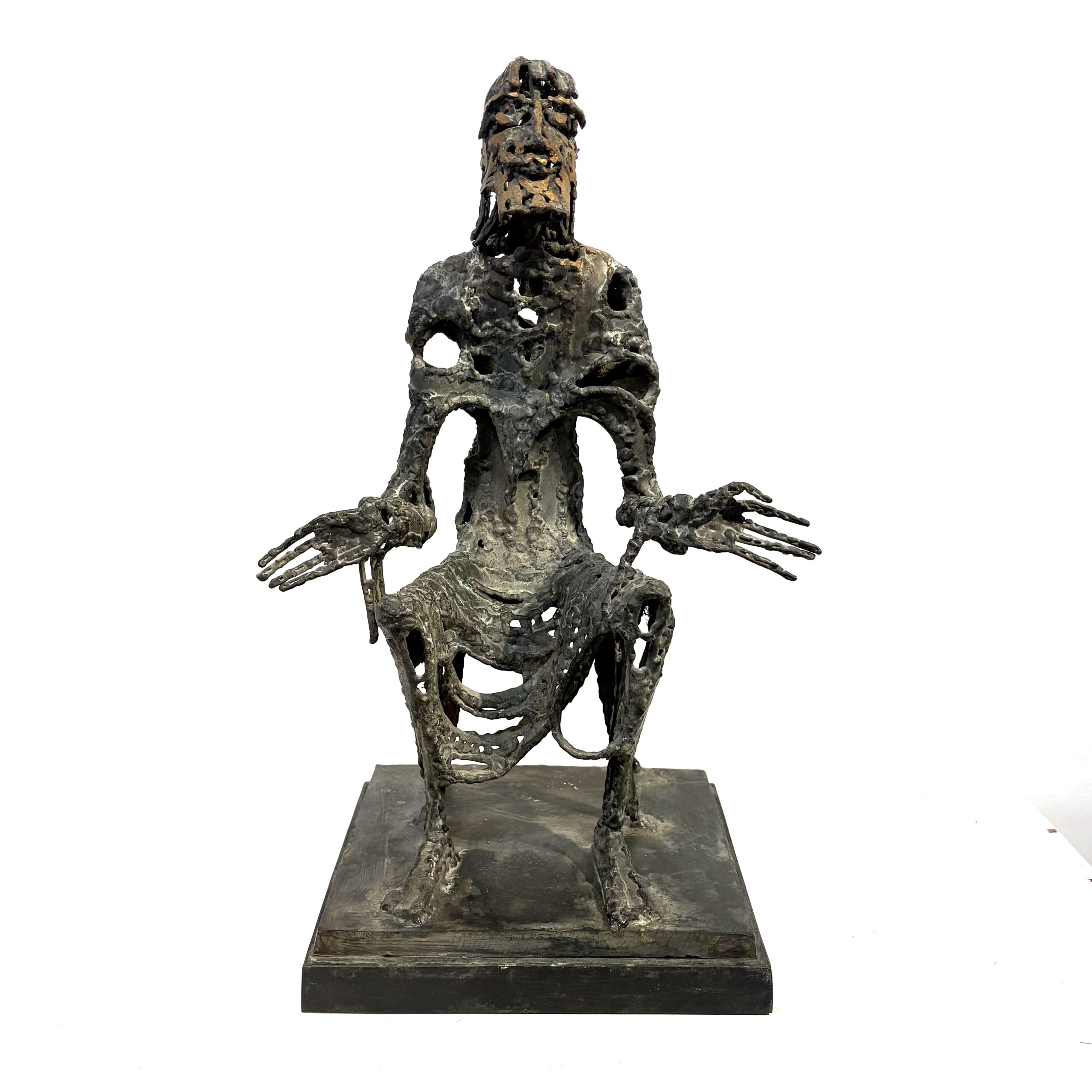 Judas by Sean Crampton. Table-top size bronze figurative sculpture of a seated man, Judas. Expressionistic in style.