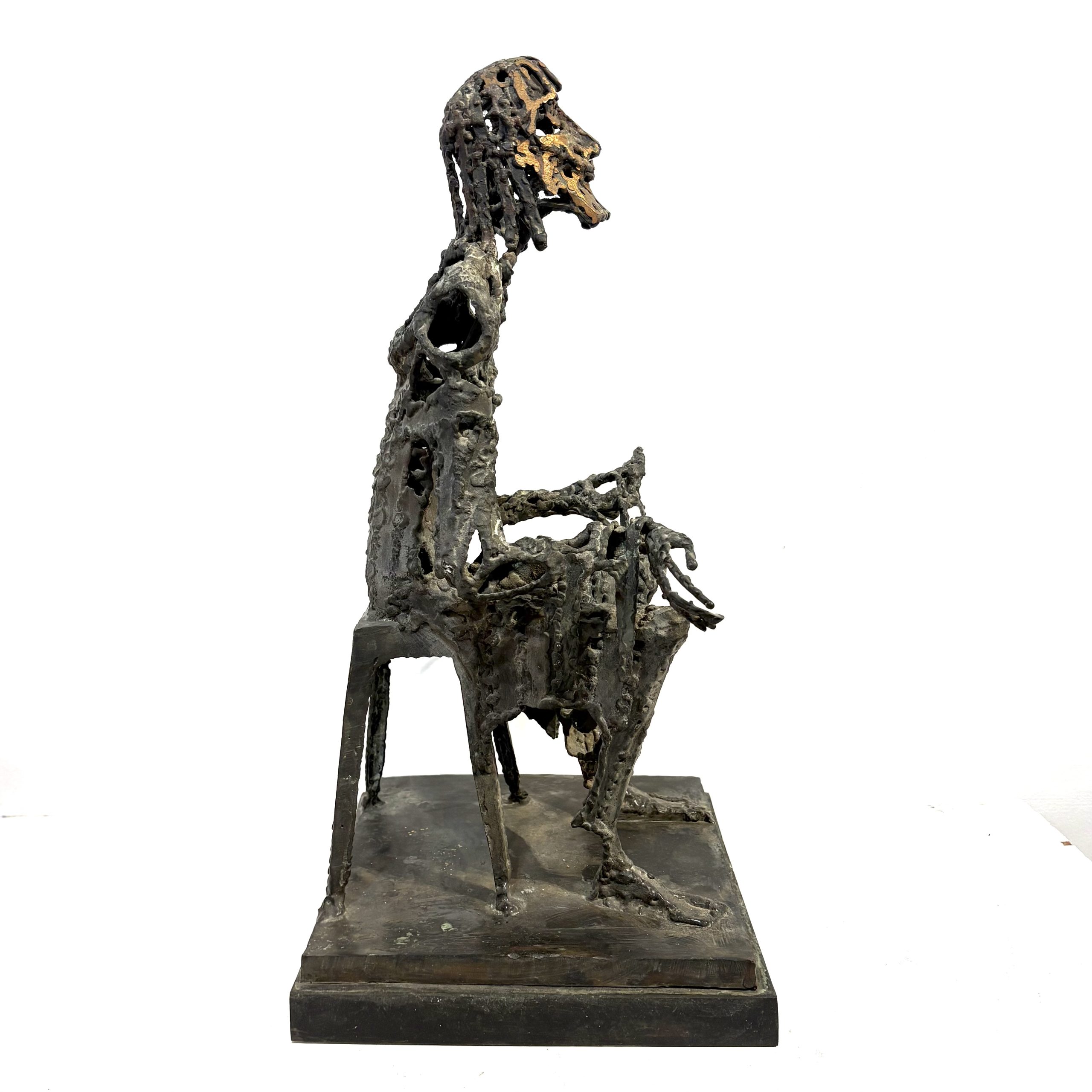 Judas by Sean Crampton. Table-top size bronze figurative sculpture of a seated man, Judas. Expressionistic in style.