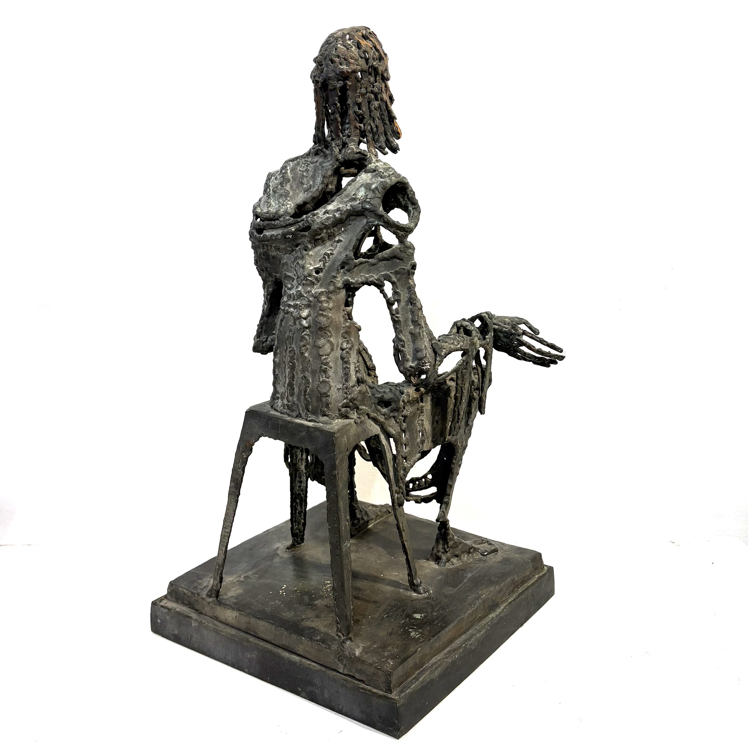 Judas by Sean Crampton. Table-top size bronze figurative sculpture of a seated man, Judas. Expressionistic in style.