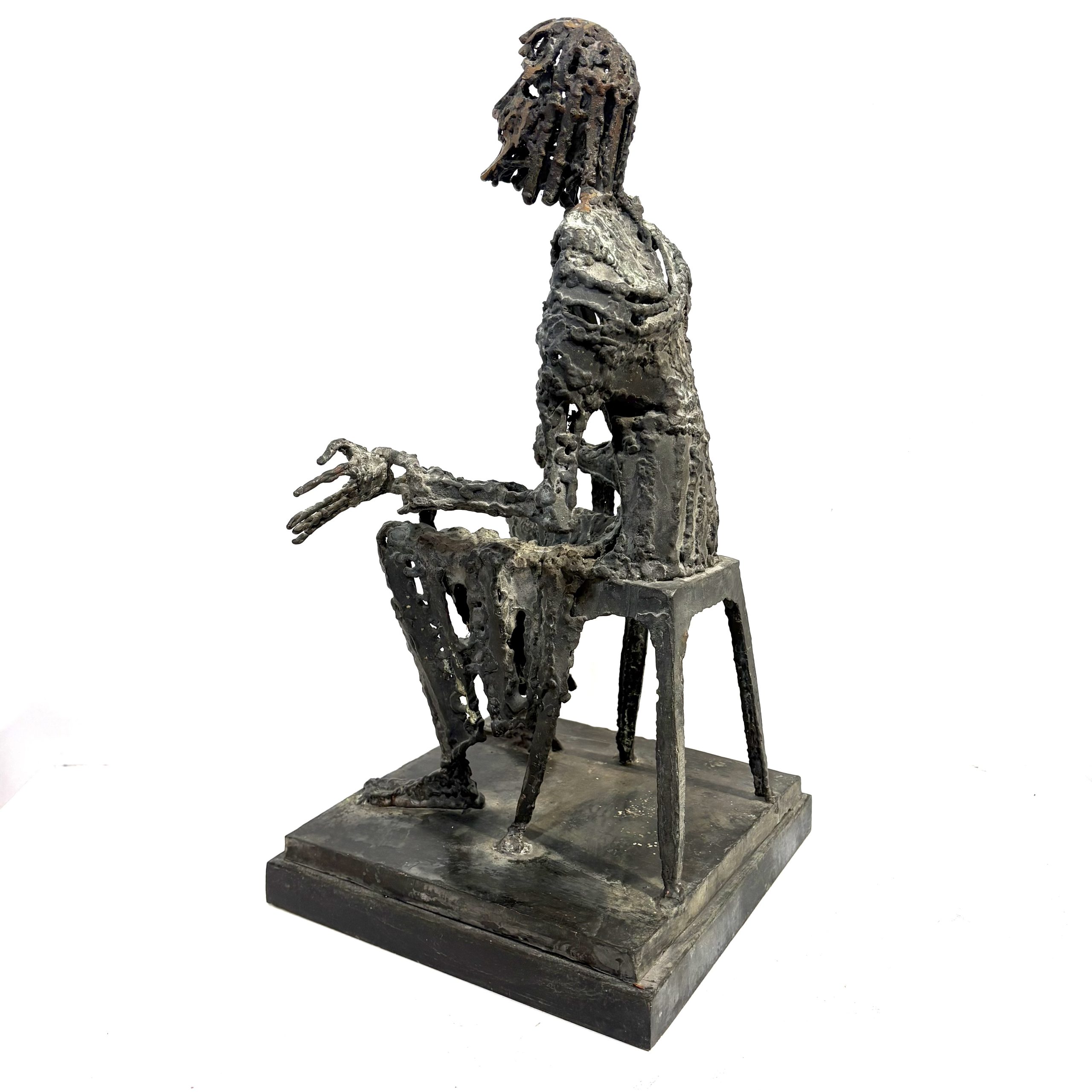 Judas by Sean Crampton. Table-top size bronze figurative sculpture of a seated man, Judas. Expressionistic in style.