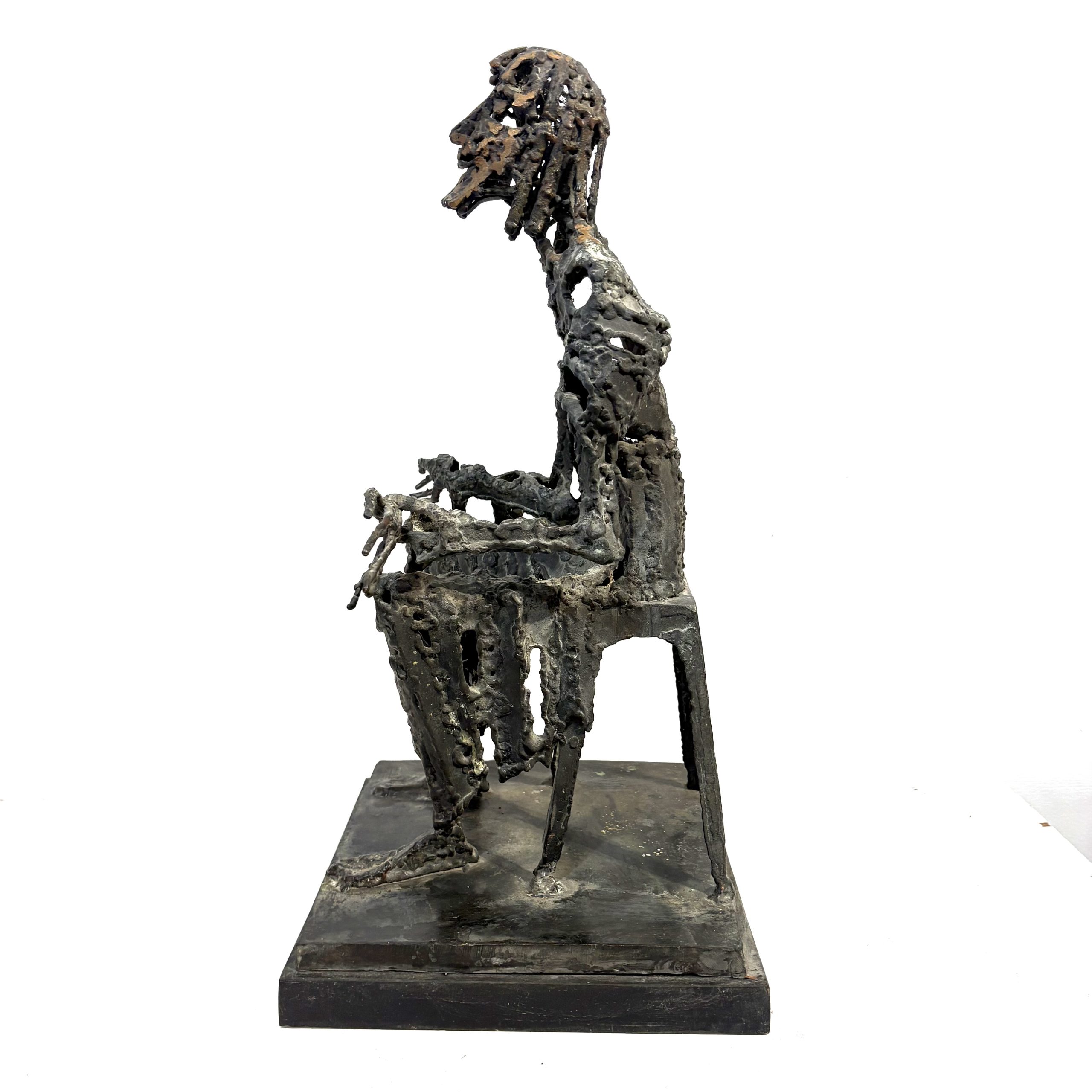 Judas by Sean Crampton. Table-top size bronze figurative sculpture of a seated man, Judas. Expressionistic in style.