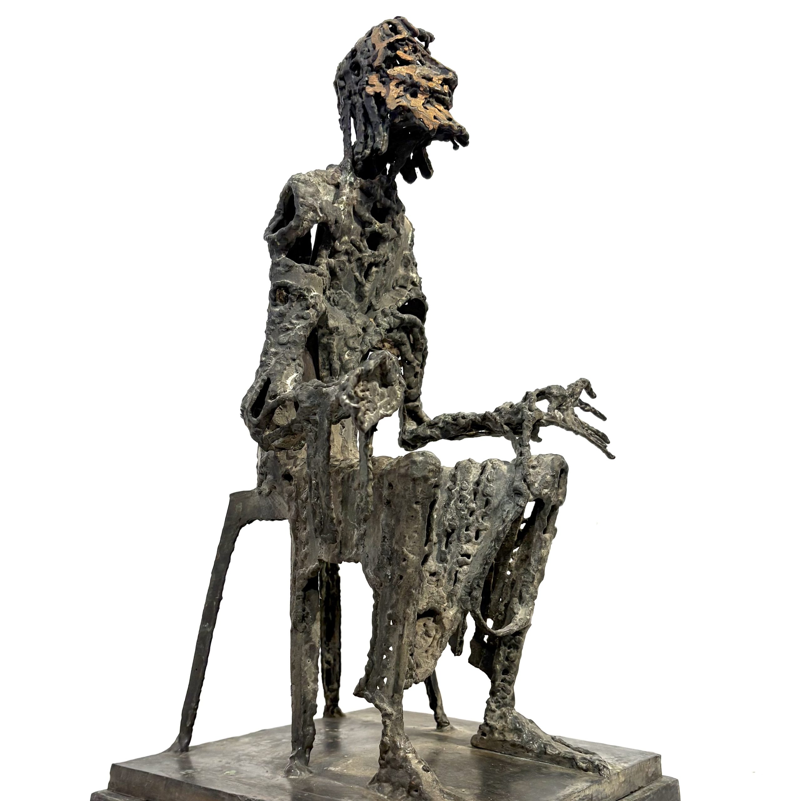 Judas by Sean Crampton. Table-top size bronze figurative sculpture of a seated man, Judas. Expressionistic in style.