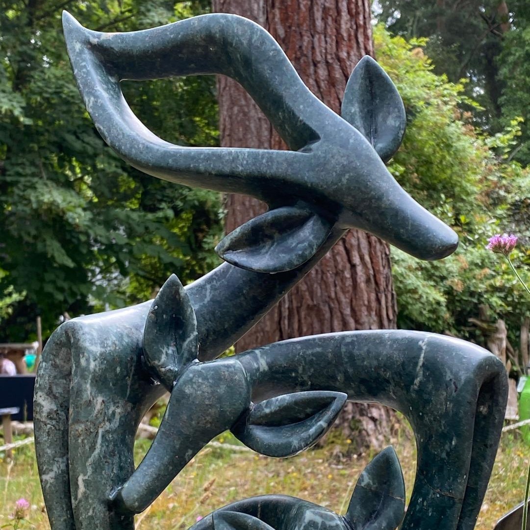 Celebrating our New Born by Fungai Dodzo. Unique Opal stone sculpture of a family of antelope