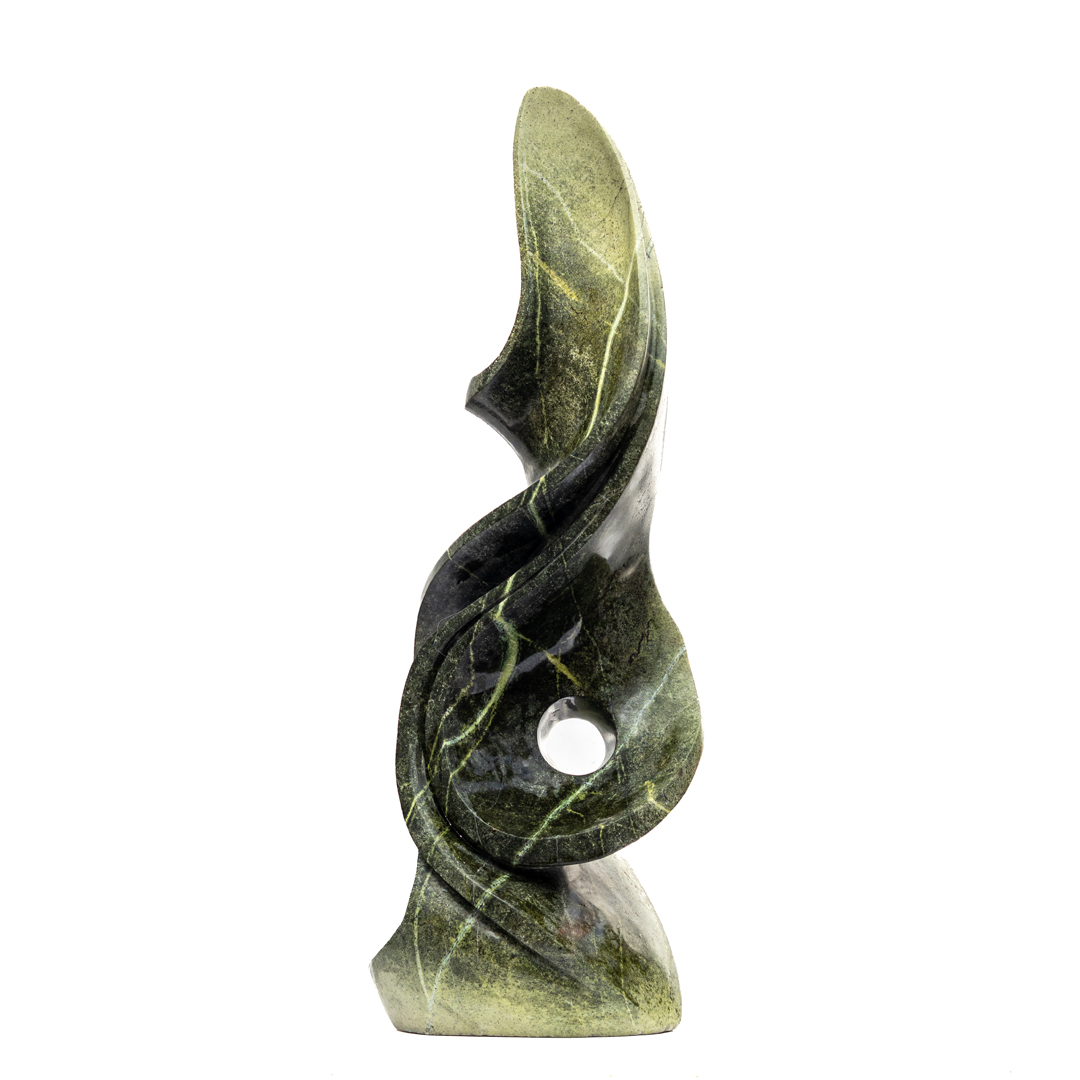Embrace by Kufa McDonald. Unique hand carved, table-top sized, abstract Shona sculpture made from avocado stone in a flame like swirling form.