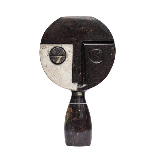 Visionary by Taylor Nkomo, a Shona Cobolt stone, Sapolite stone, and Sprinstone sculpture of a abstract face with two different coloured sides to its face.