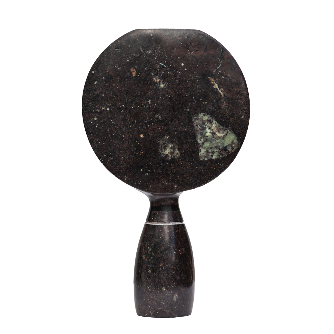 Visionary by Taylor Nkomo, a Shona Cobolt stone, Sapolite stone, and Sprinstone sculpture of a abstract face with two different coloured sides to its face.
