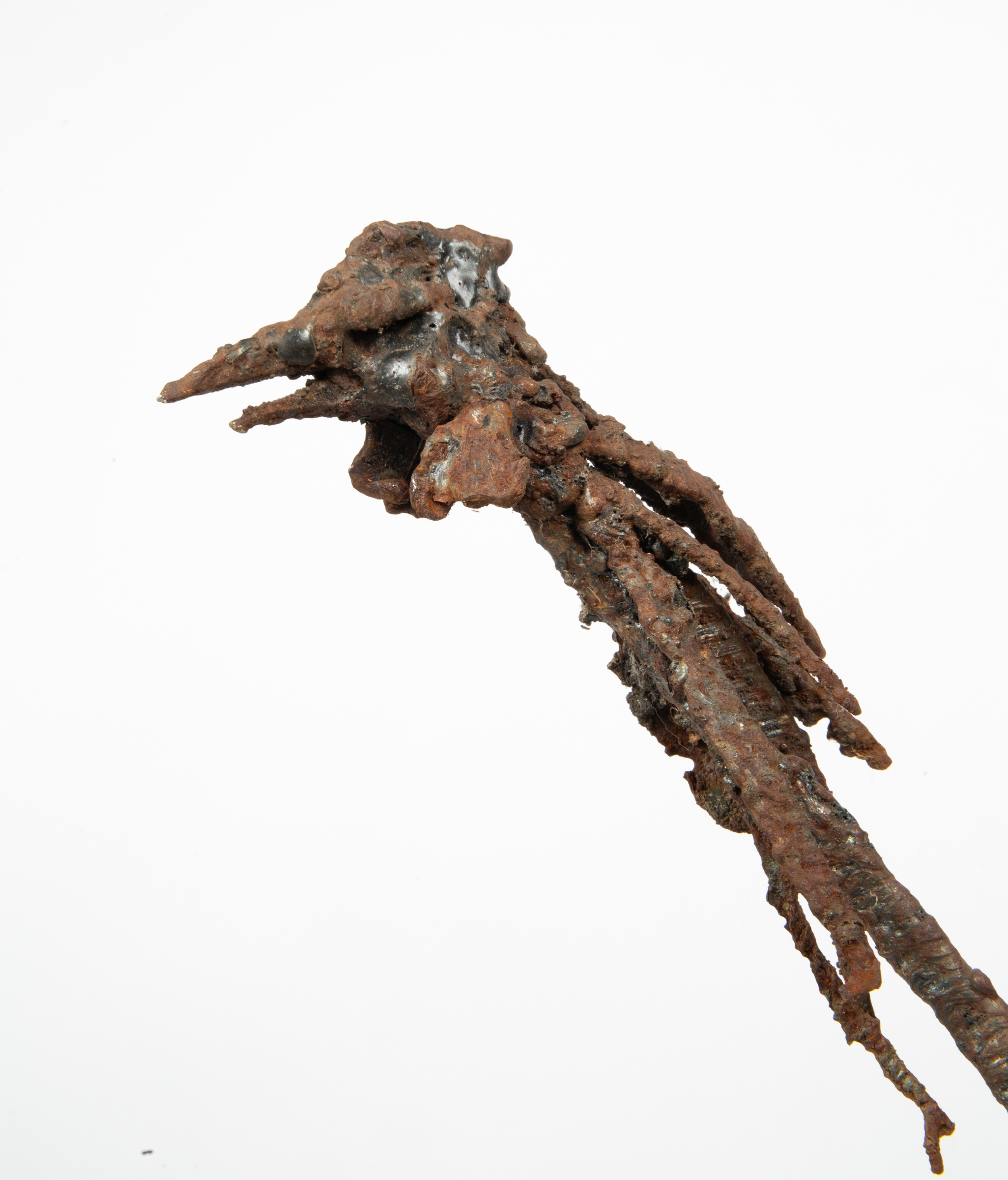 A figurative metal sculpture of a long thin chicken.