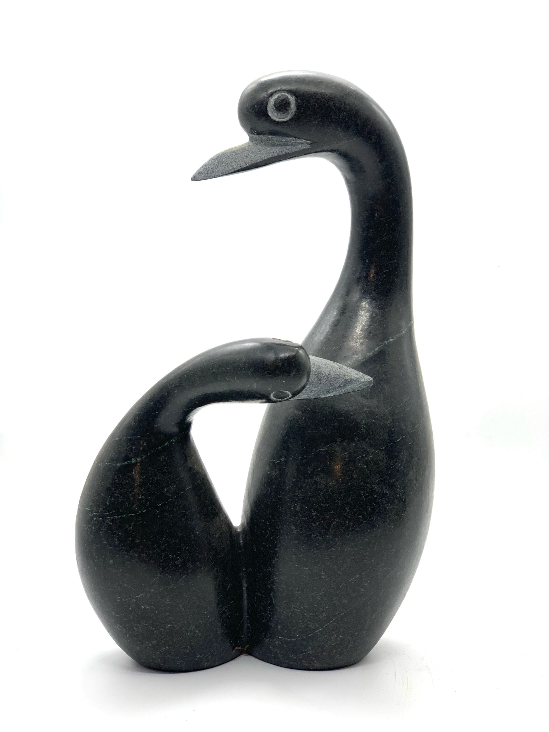 A smaller scale Shona sculpture made of Springstone showing 2 birds in an embrace.