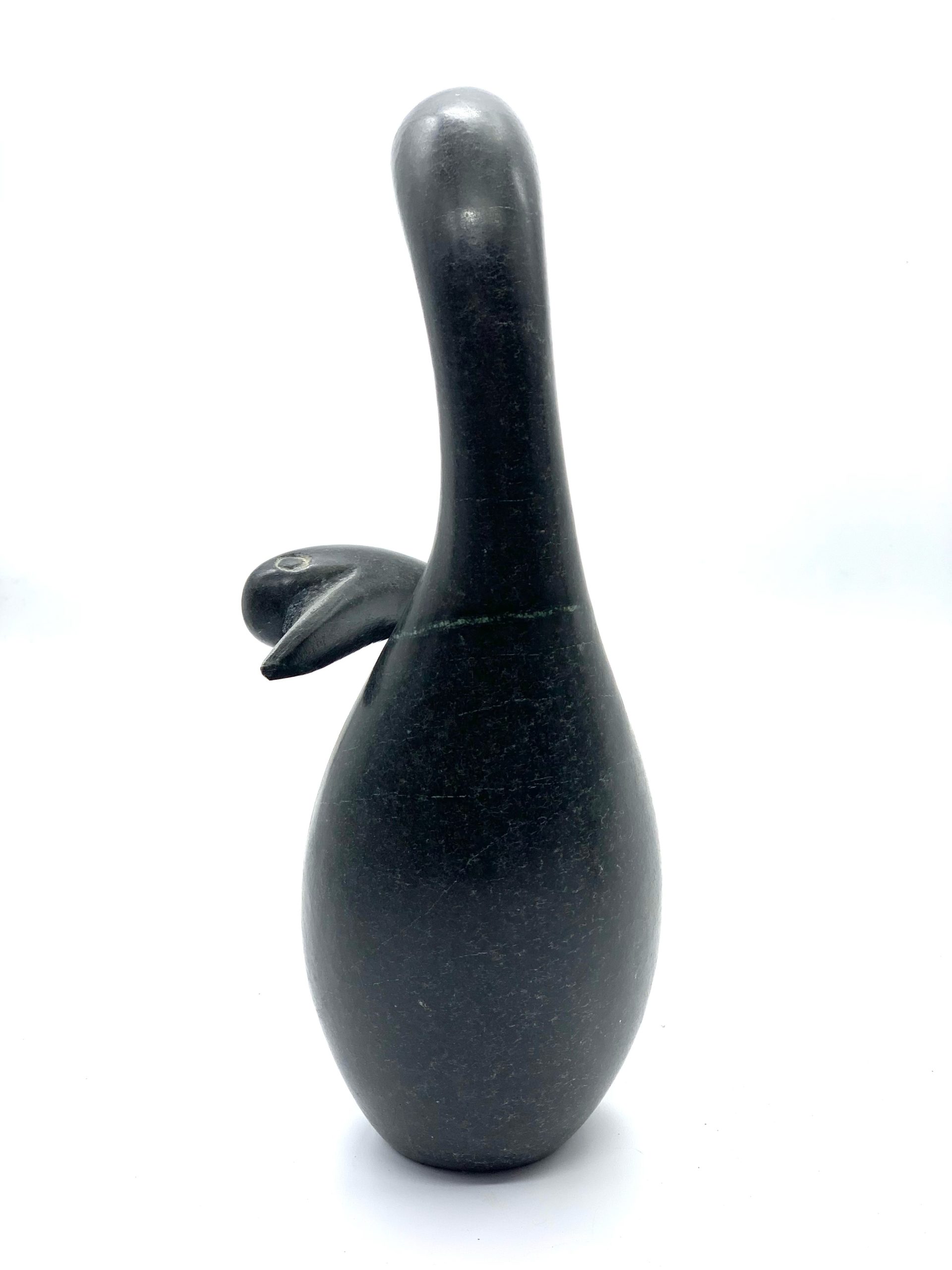 A smaller scale Shona sculpture made of Springstone showing 2 birds in an embrace.