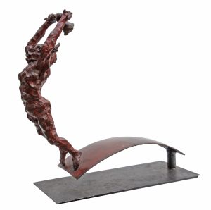 The Bell Ringer by Bushra Fakhoury. A figurative bronze sculpture of a person diving off a plank while ringing a bell.