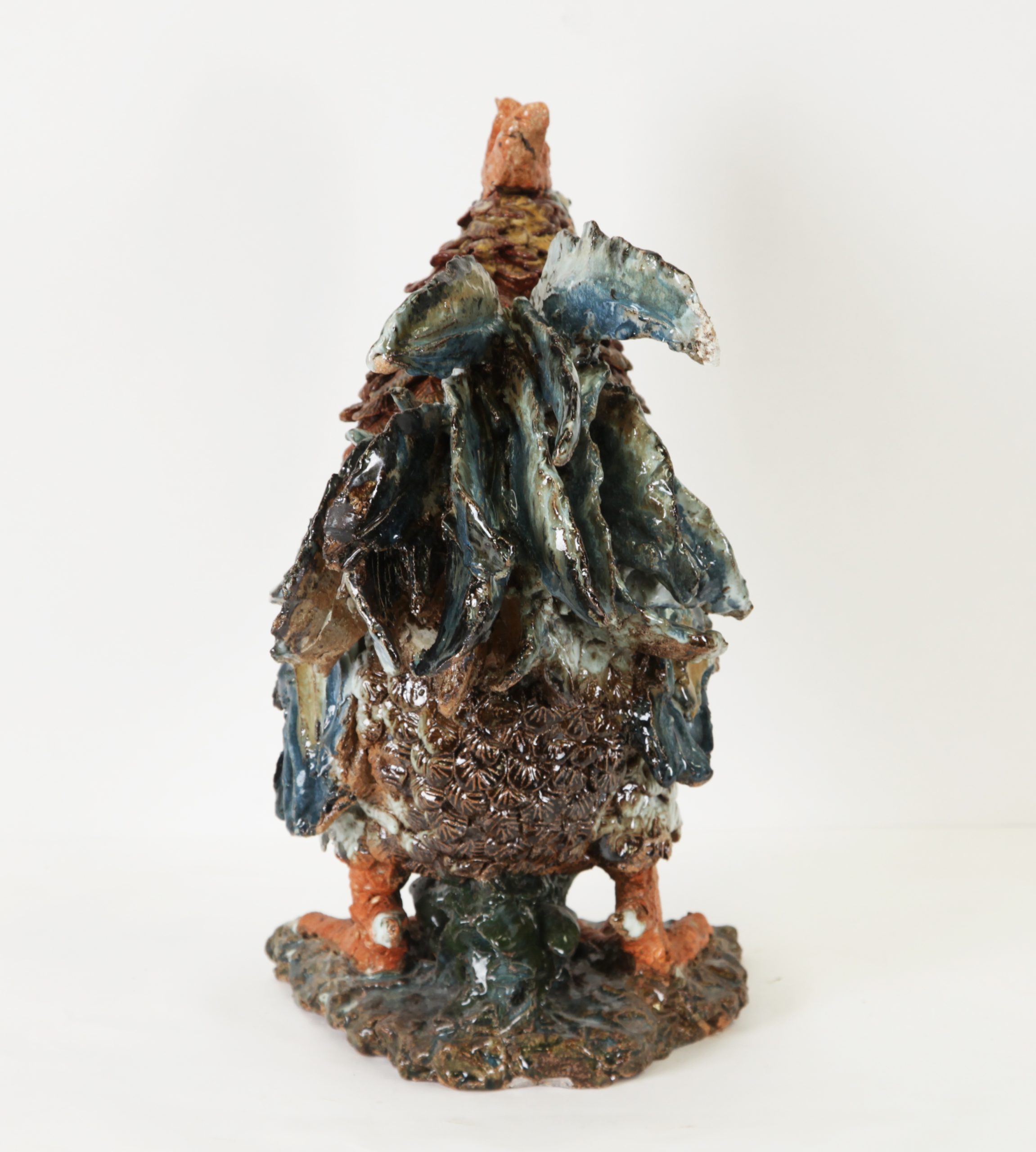 Cockerel by Colin Kellam is a realistic ceramic sculpture of a charming rooster