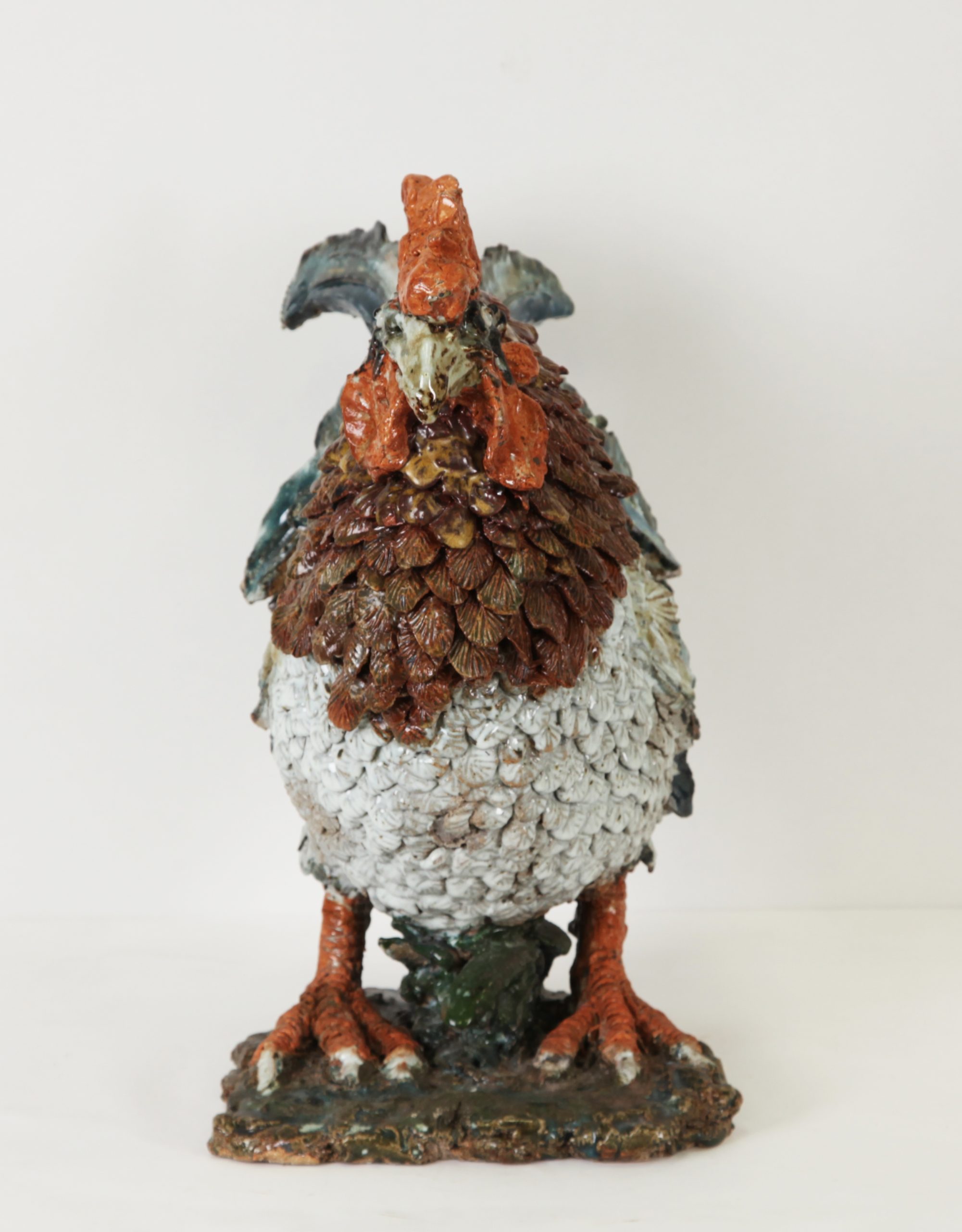 Cockerel by Colin Kellam is a realistic ceramic sculpture of a charming rooster