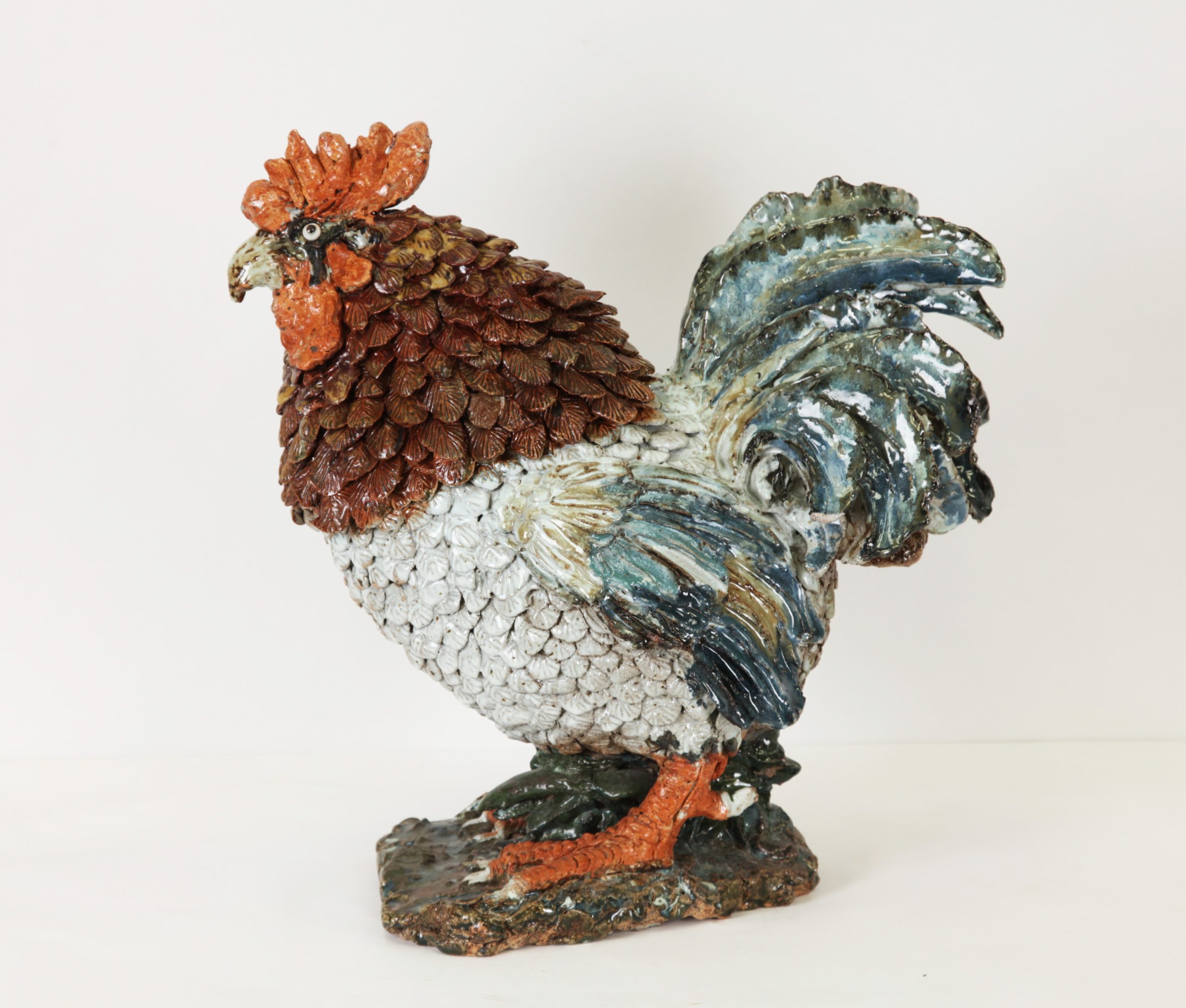 Cockerel by Colin Kellam is a realistic ceramic sculpture of a charming rooster