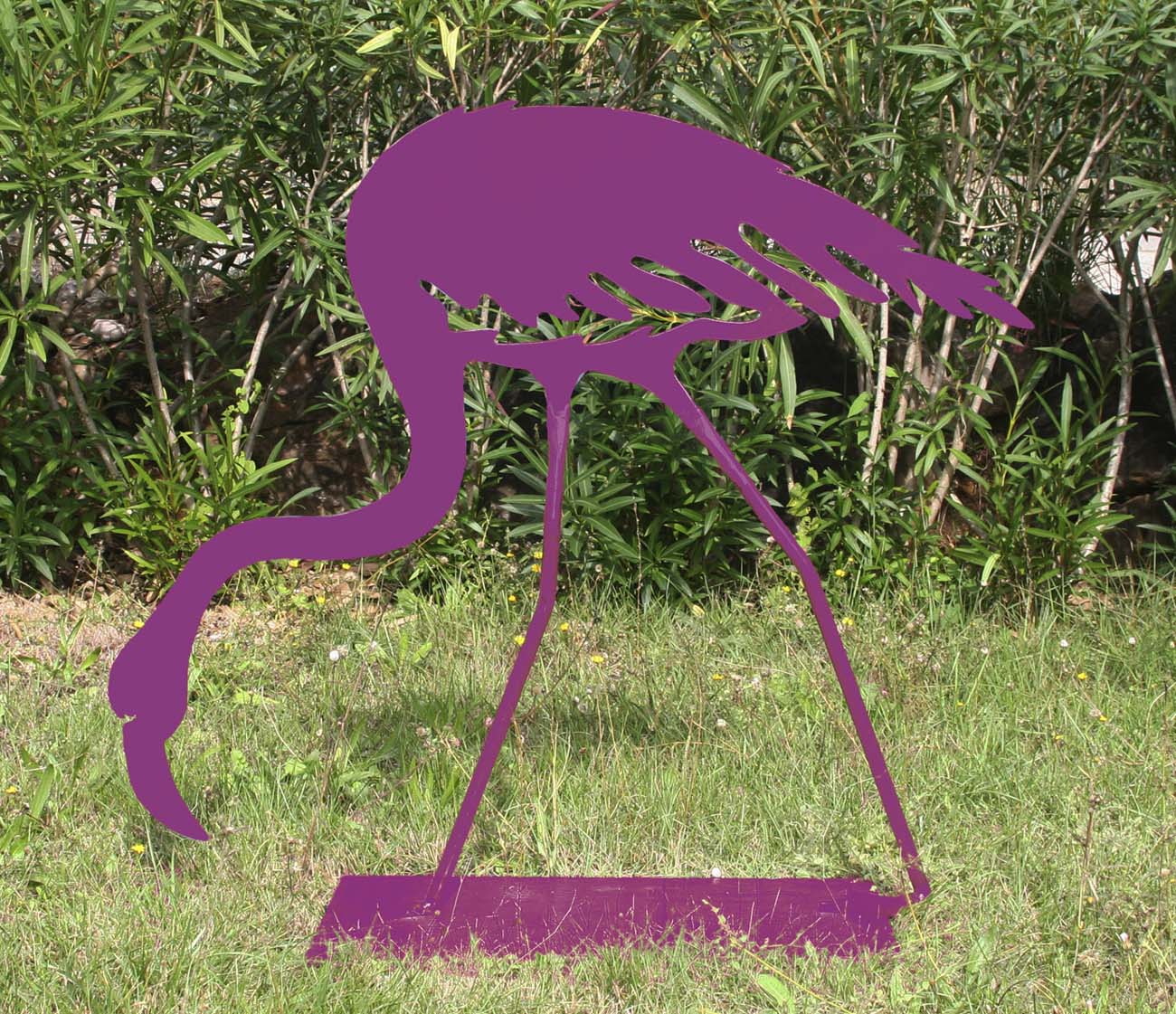 A Pop art steel sculpture of a purple flamingo pecking around at the ground.